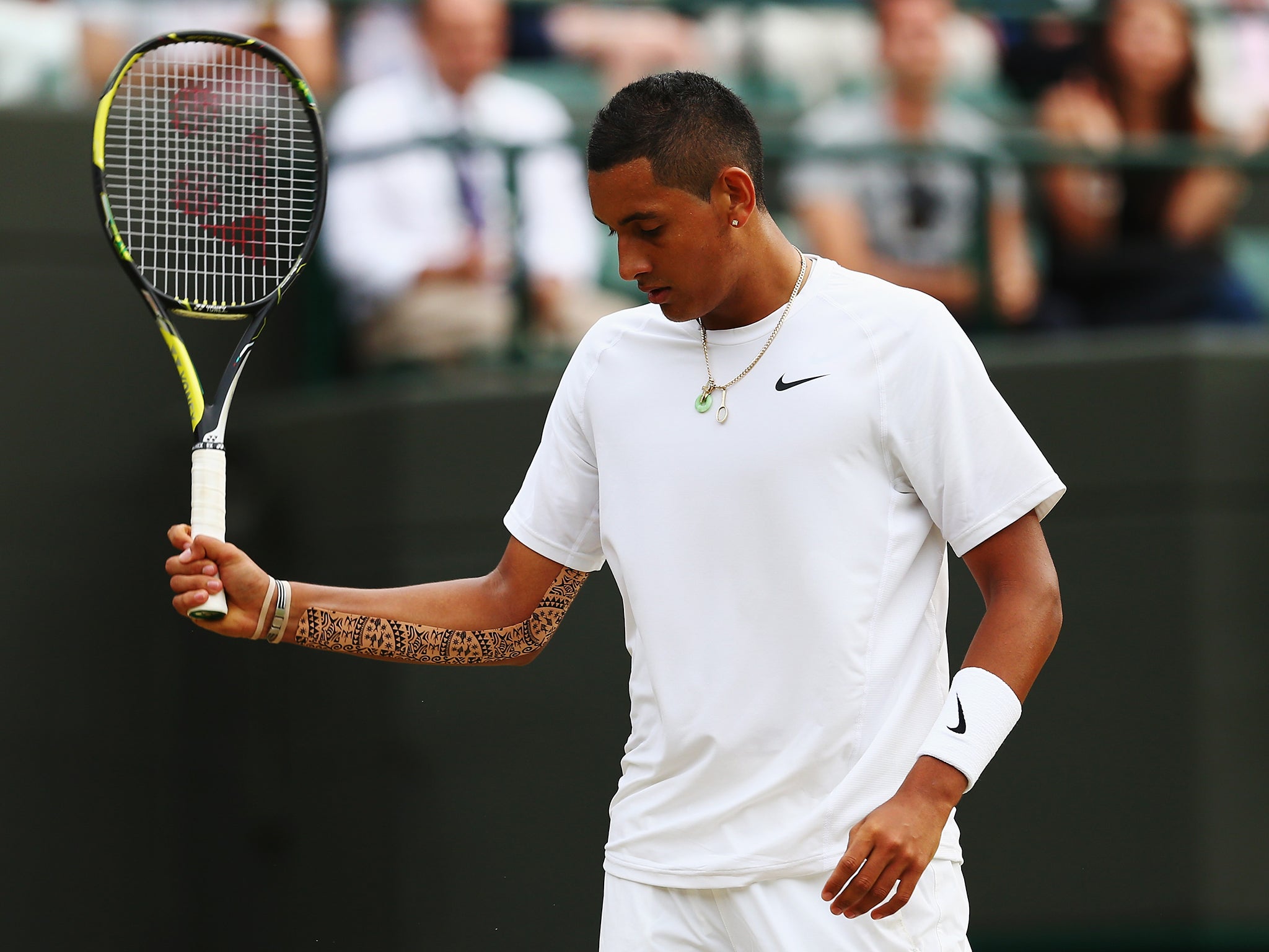 Nick Kyrgios shows his frustration during his Gentlemen's Singles quarter-final match defeat to Milos Raonic
