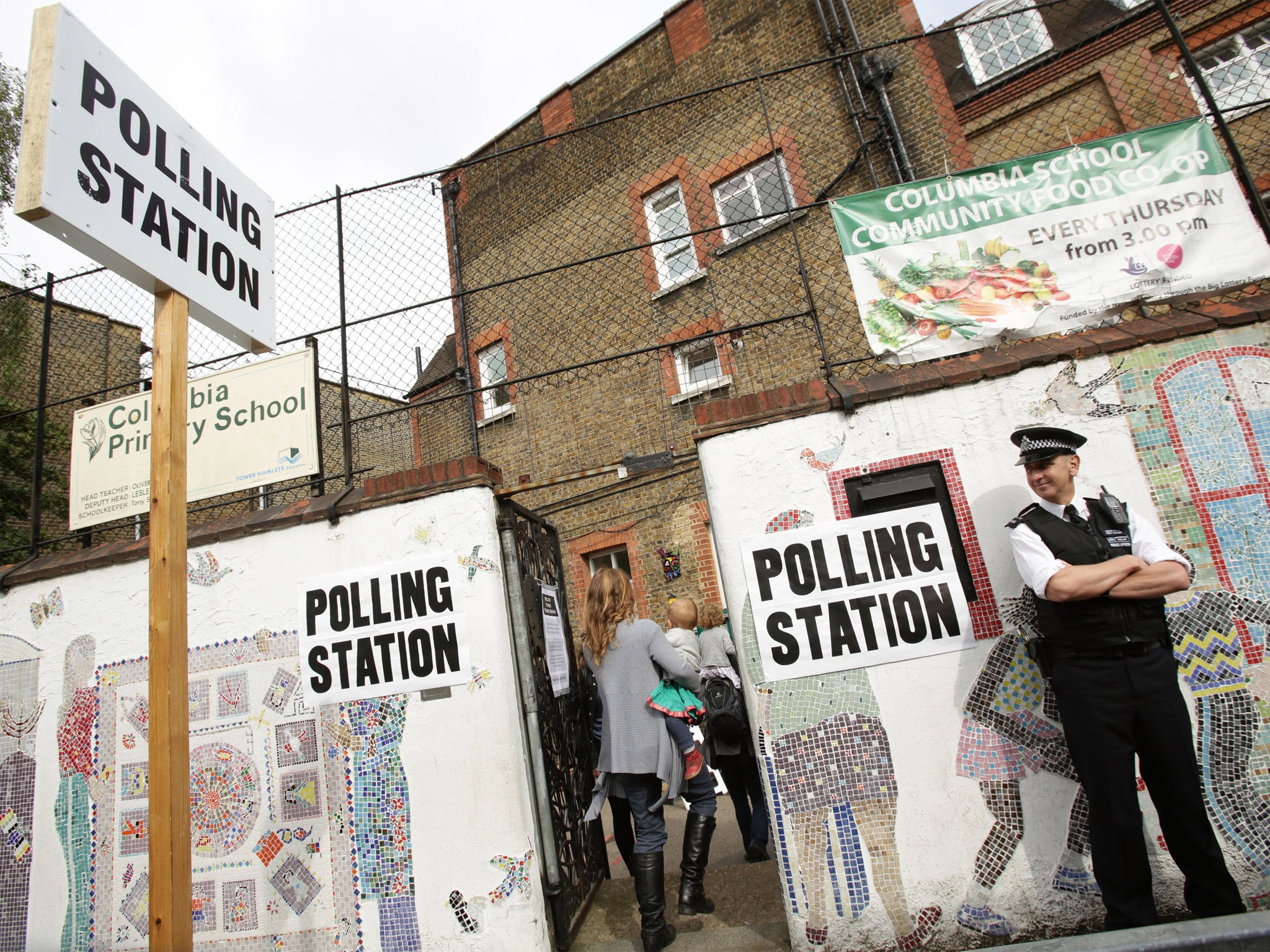 A police officer at a polling station in Tower Hamlets as part of a crackdown on voter intimidation at May’s local elections