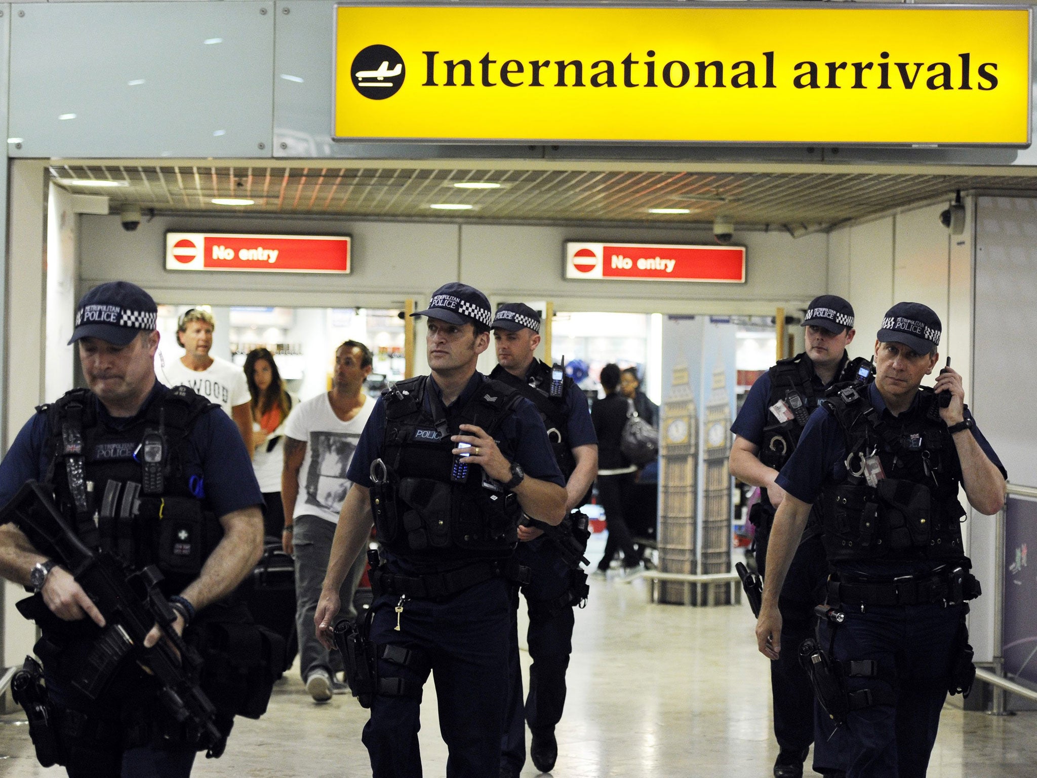 A file picture dated 23 July 2012 shows British police on patrol at Heathrow airport. US security officials are seeking to bolster security at airports abroad with flights to the United States amid new worries about potential bomb plots