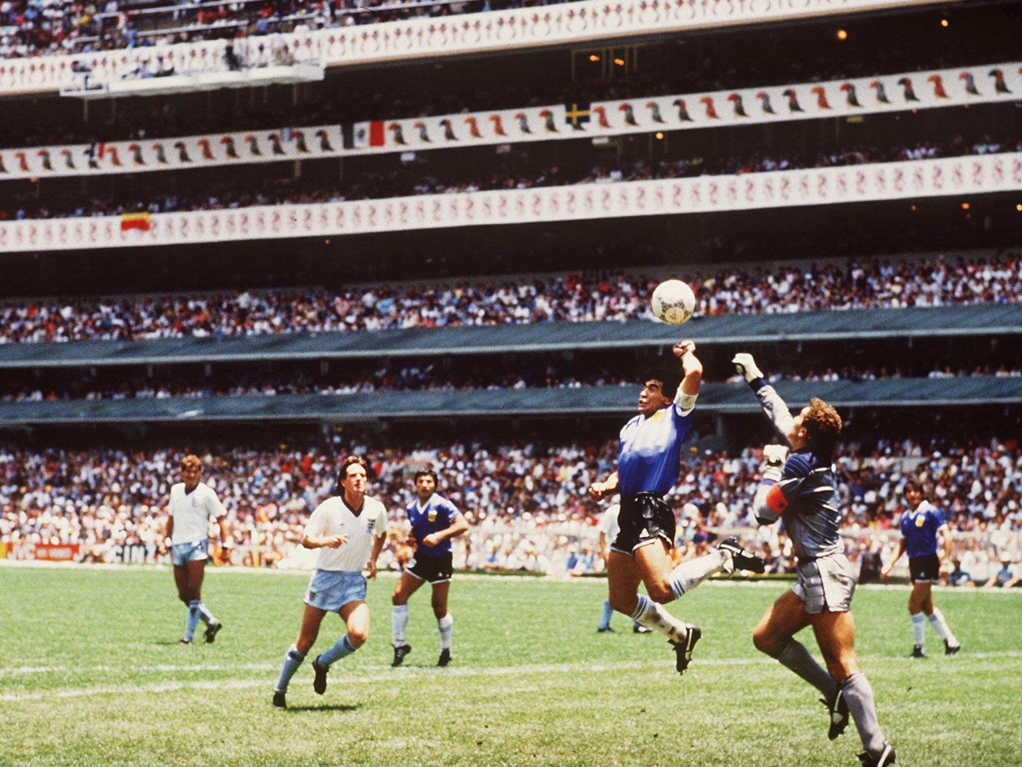 Diego Maradona scores his infamous 'Hand of God' goal against England in 1986