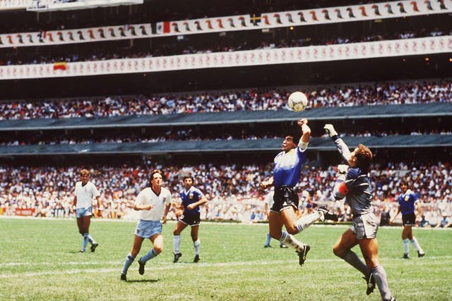 Diego Maradona scores his infamous 'Hand of God' goal against England in 1986