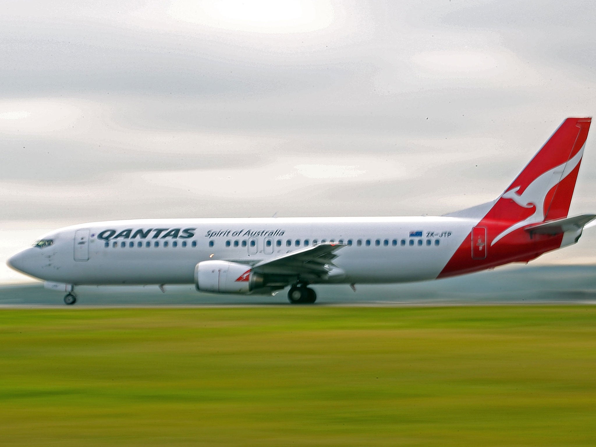 A Qantas Airways plane was forced to return back to Los Angeles when a burst pipe sent a “river” of water down the aisles and drenched passengers on board.