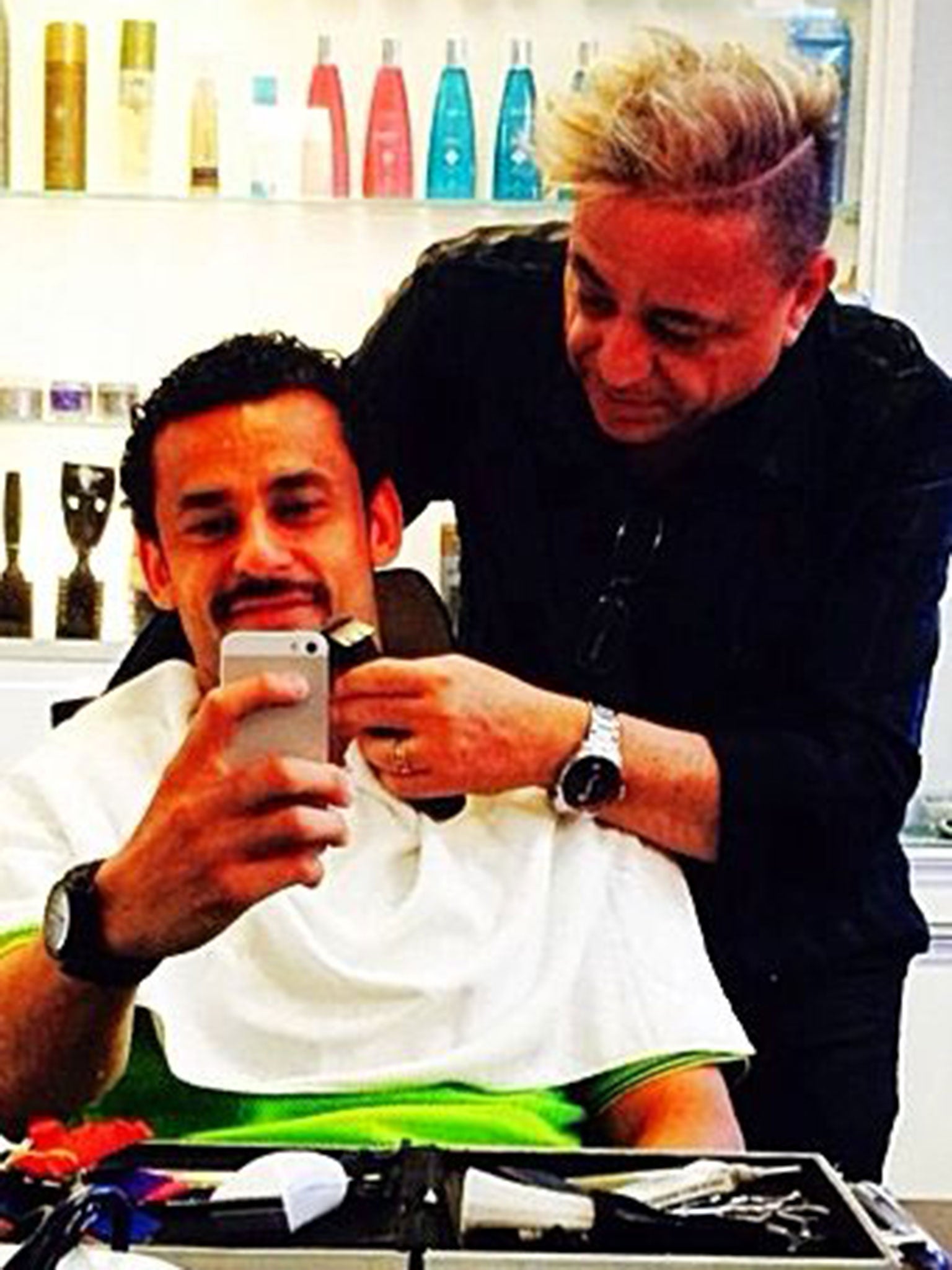 Fred getting his moustache at the barber shop