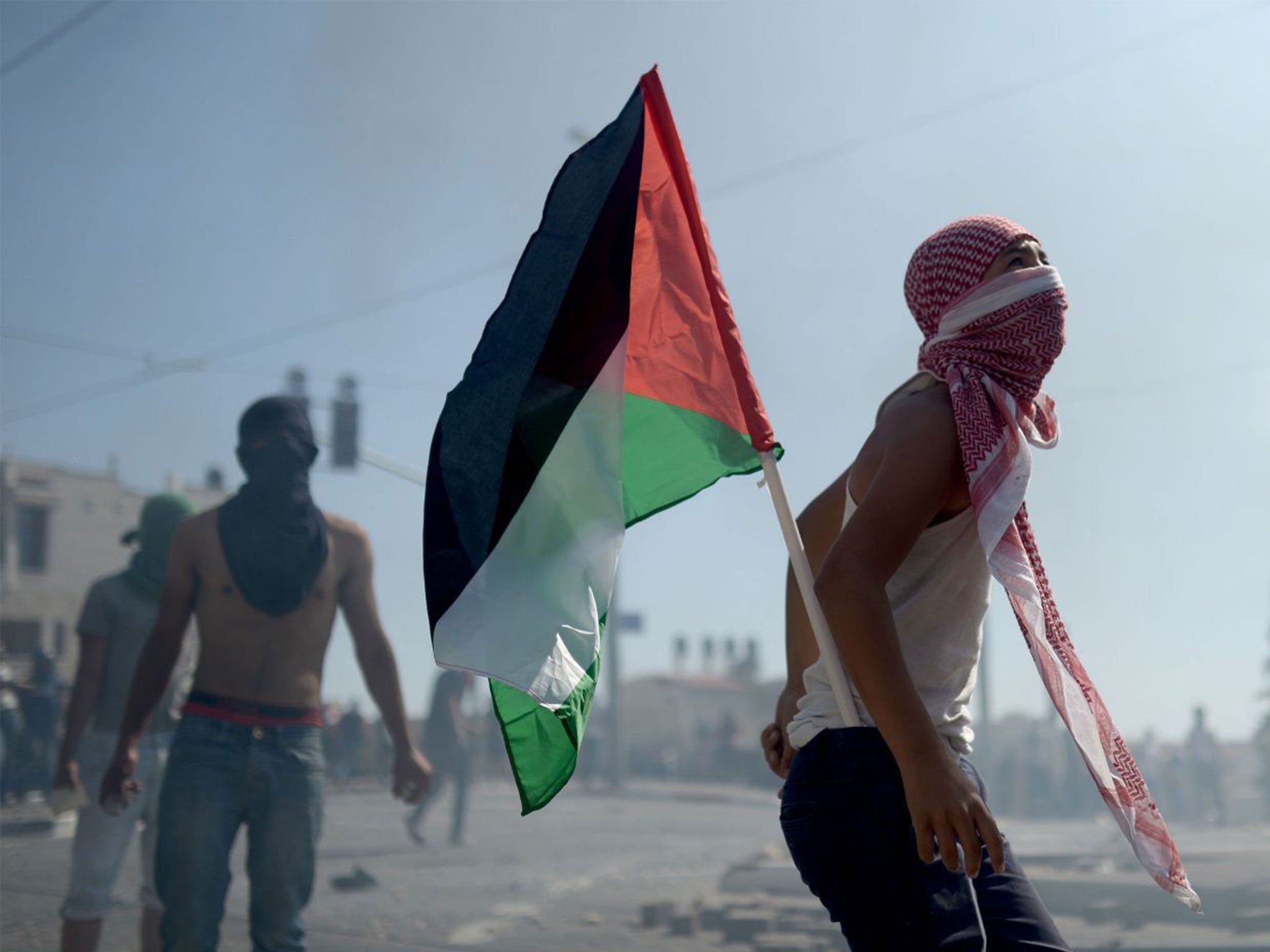 Palestinians clash with Israeli security forces near Jerusalem as tensions in the region rise following the abduction and killing of a Palestinian youth and the murder of three Israeli teenagers