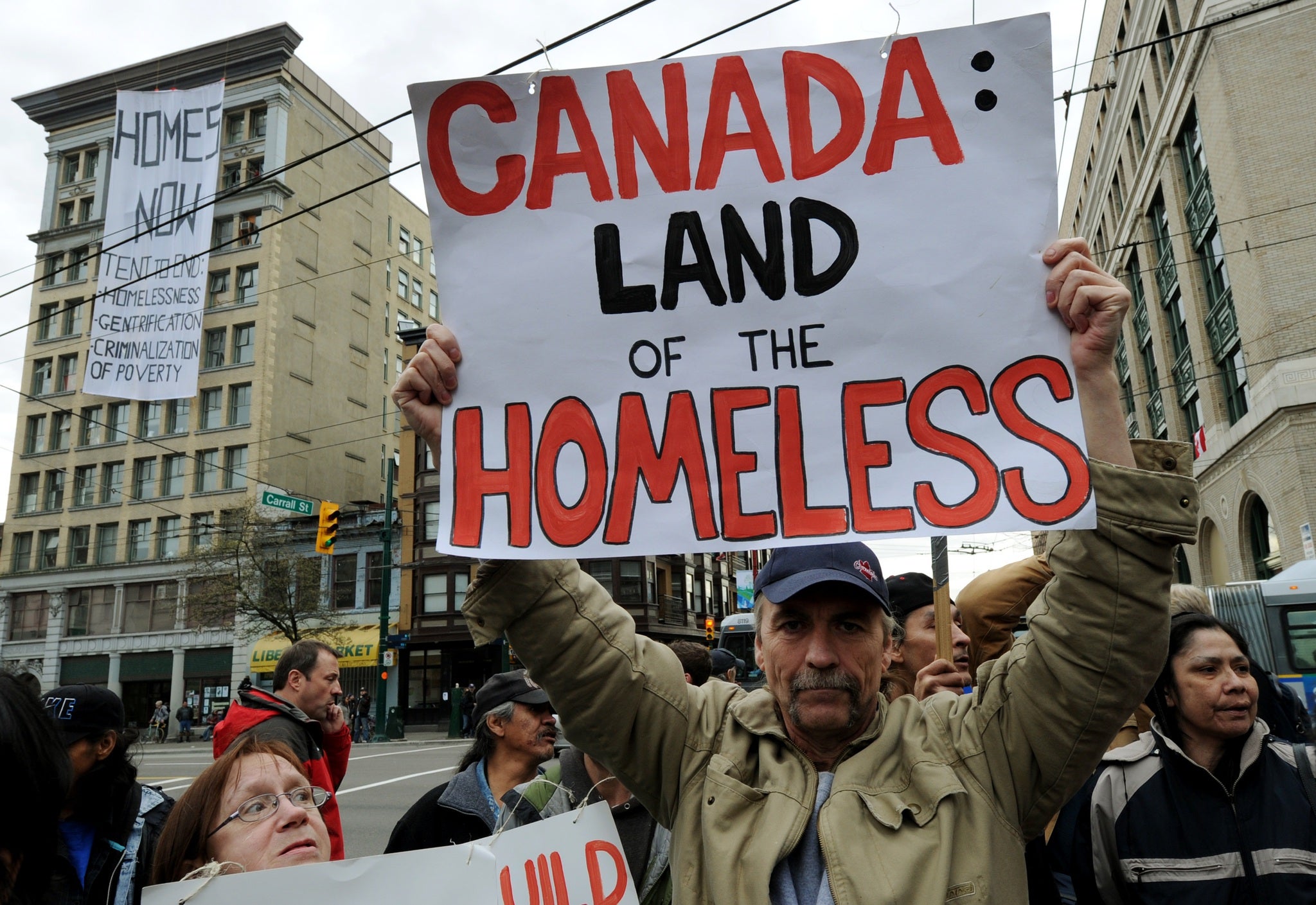 A man protests against homelessness in Vancouver in 2010