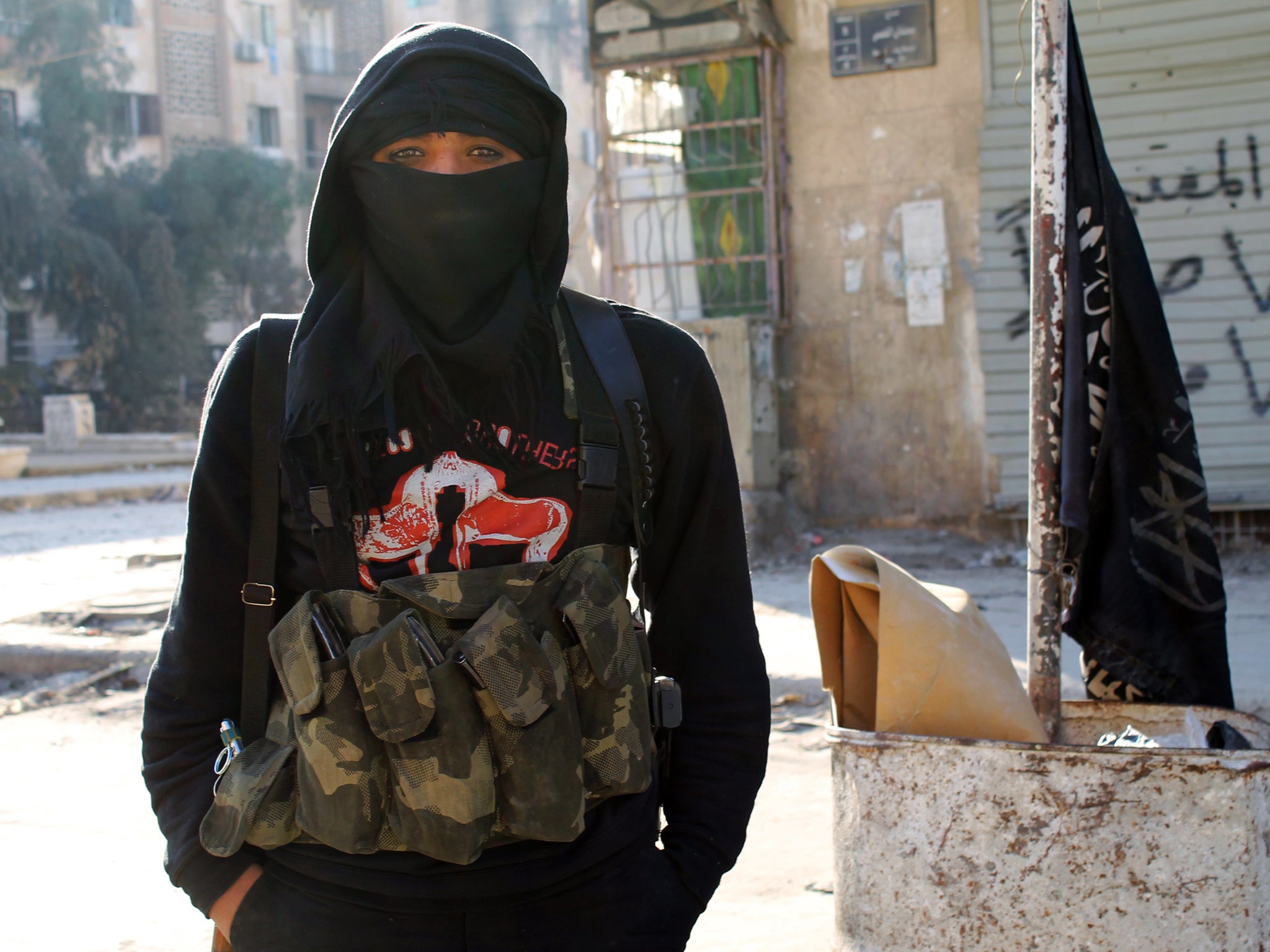 A member of jihadist group Al-Nusra Front stands in a street of the northern Syrian city of Aleppo. BARAA AL-HALABI/AFP/Getty Images