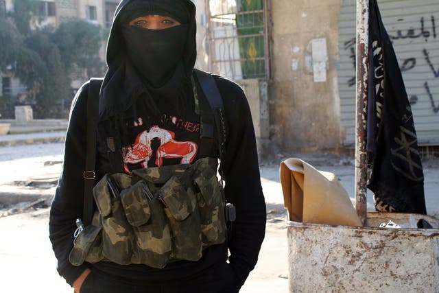 A member of jihadist group Al-Nusra Front stands in a street of the northern Syrian city of Aleppo. BARAA AL-HALABI/AFP/Getty Images
