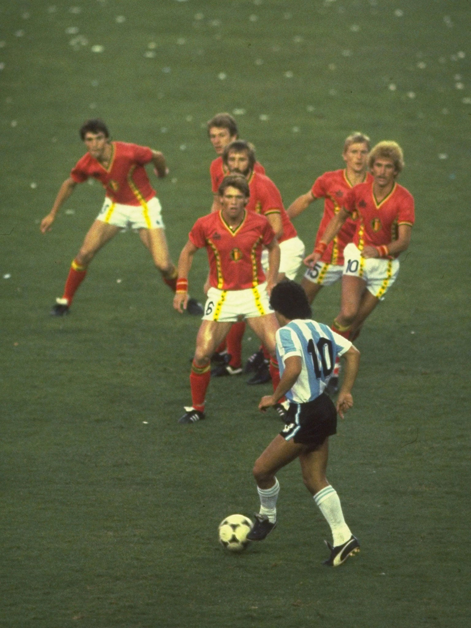 Diego Maradona faces four Belgian defenders at the 1982 World Cup