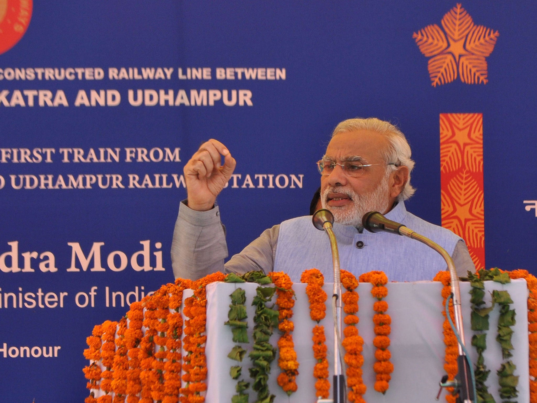 Indian Prime Minister Narendra Modi speaks during the inauguration ceremony at Katra railway station in Katra