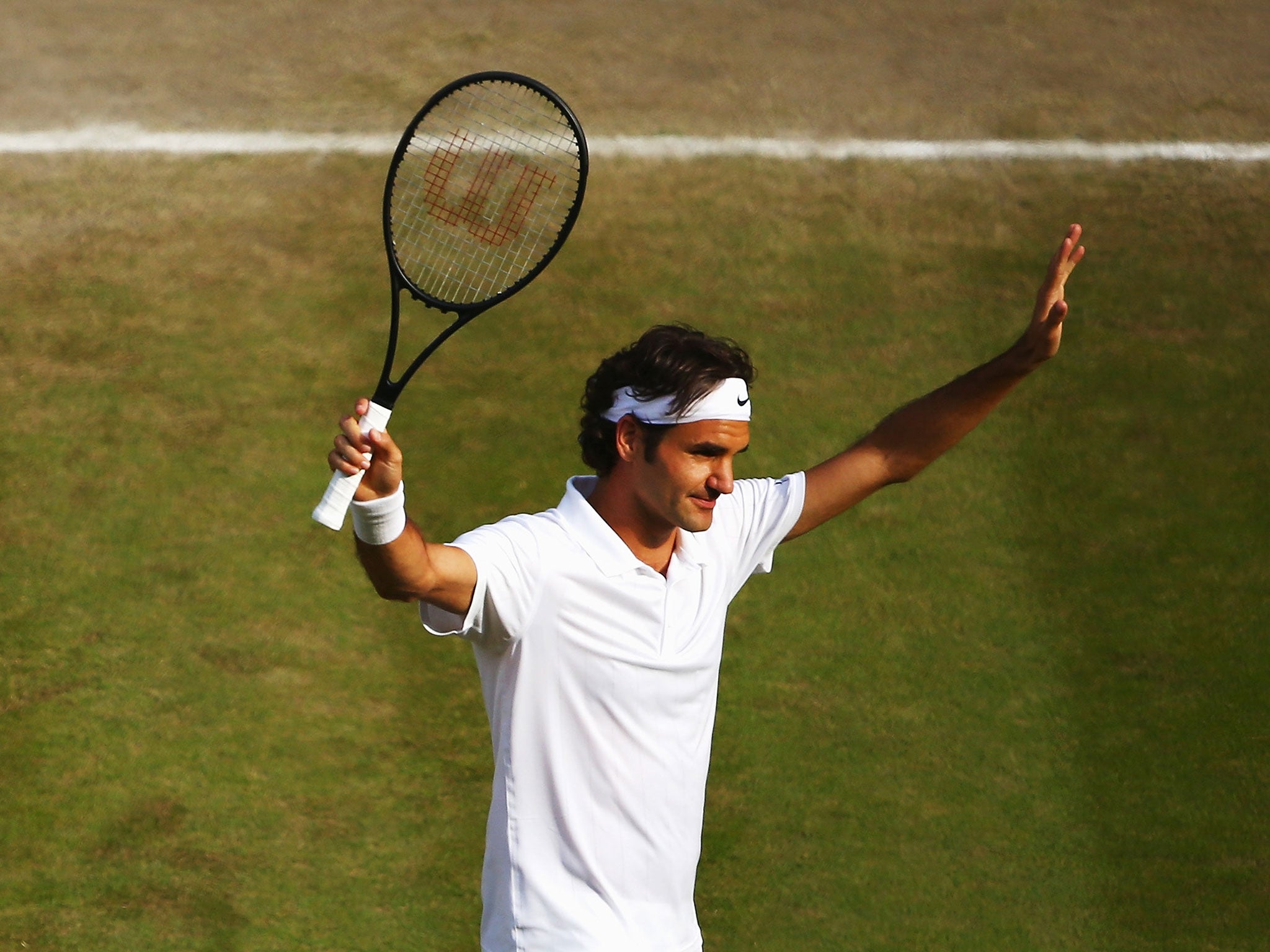 Roger Federer celebrates his win over Milos Raonic