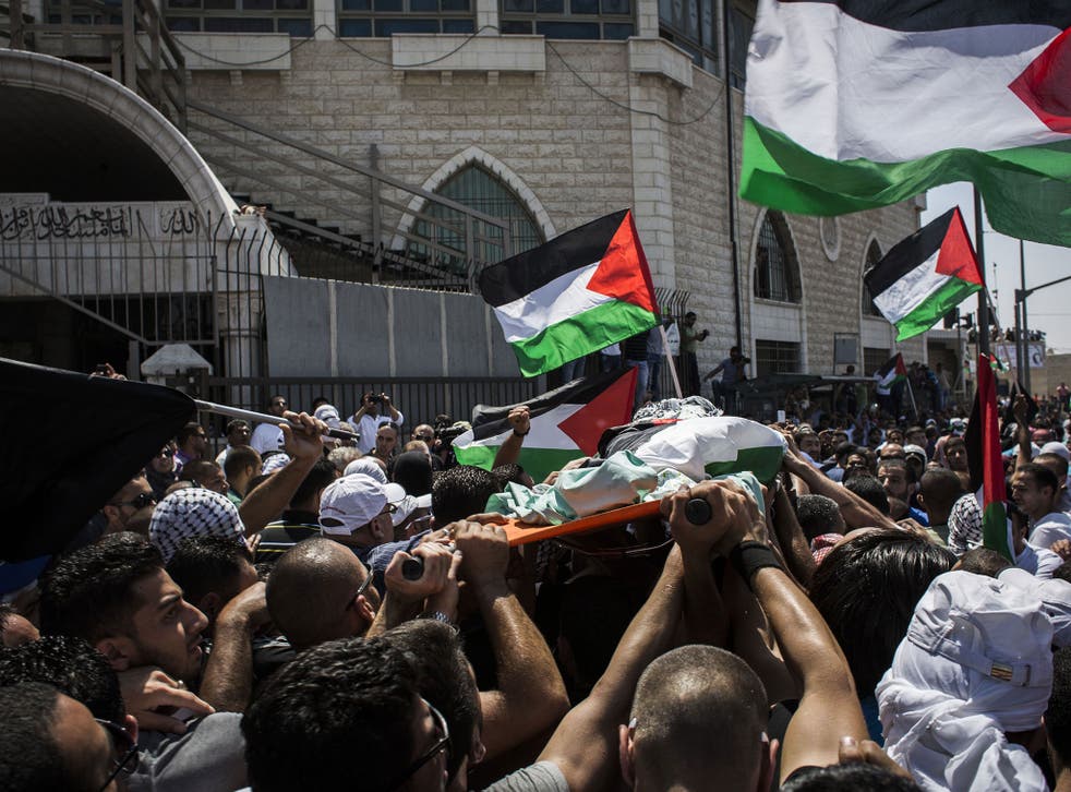 The funeral of Mohammed Abu Khdeir in East Jerusalem
yesterday, where there were violent clashes