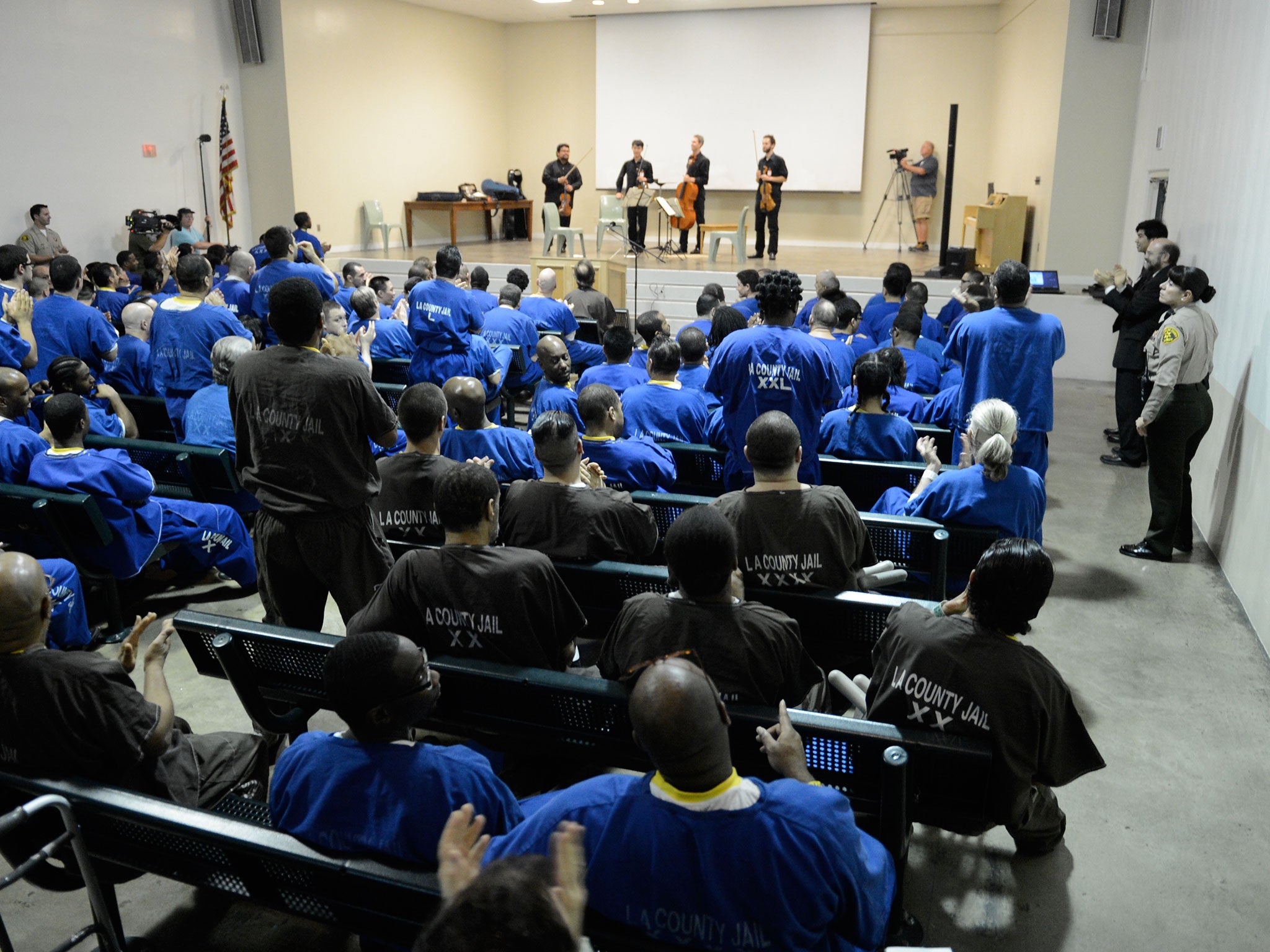 Vijay Gupta and his colleagues at a prison in Los Angeles