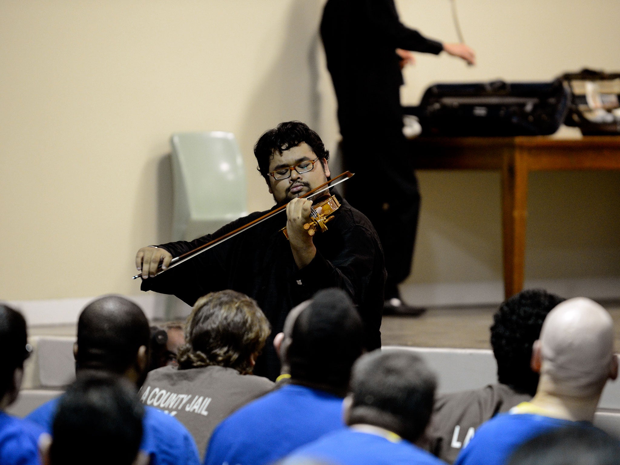 Vijay Gupta and his colleagues playing a Street Symphony concert at Twin Towers jail in Los Angeles