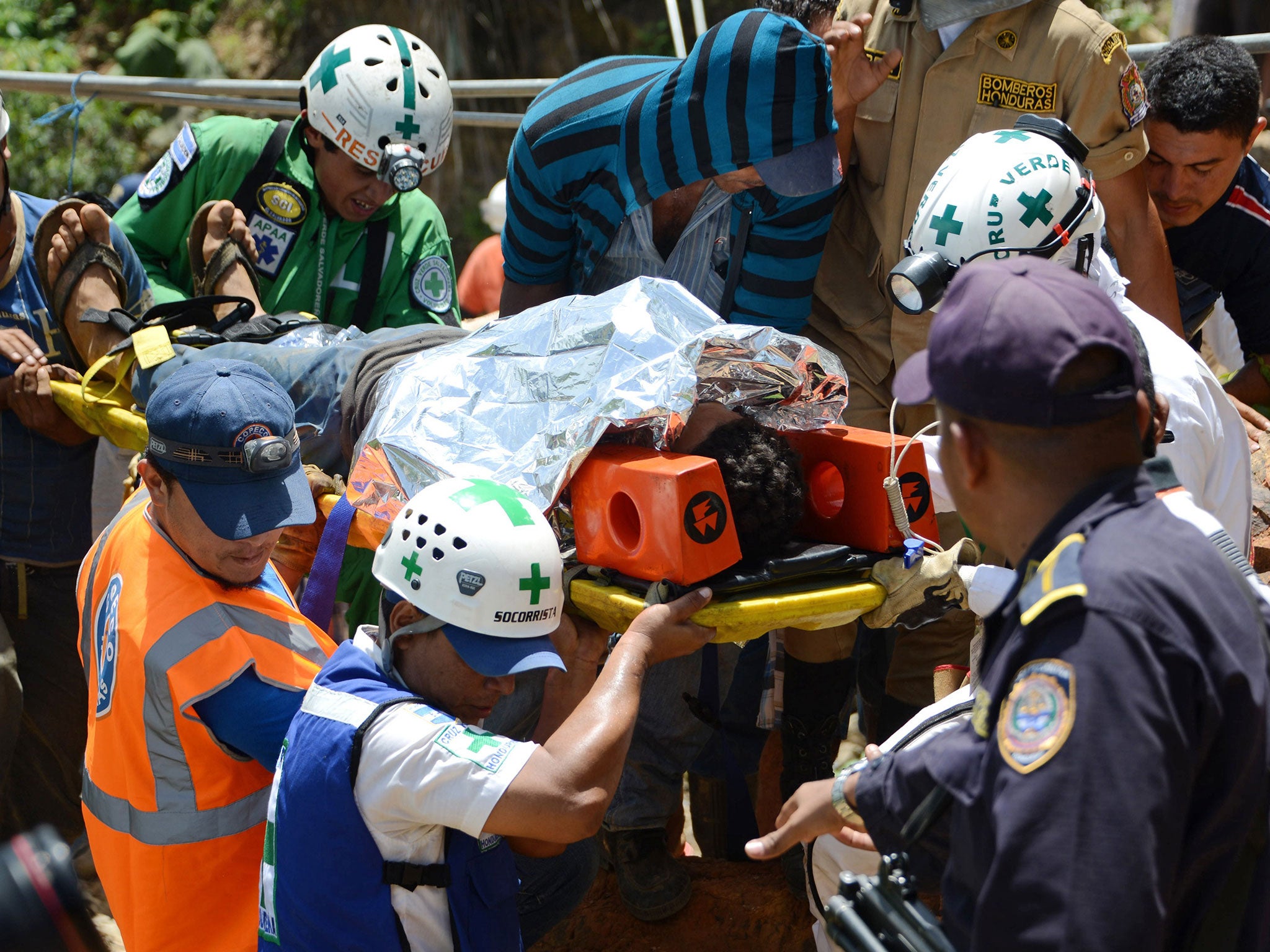 One of the three freed labourers who were trapped, along with eight more who are still missing, in a collapsed mine in the Honduran region of Choluteca