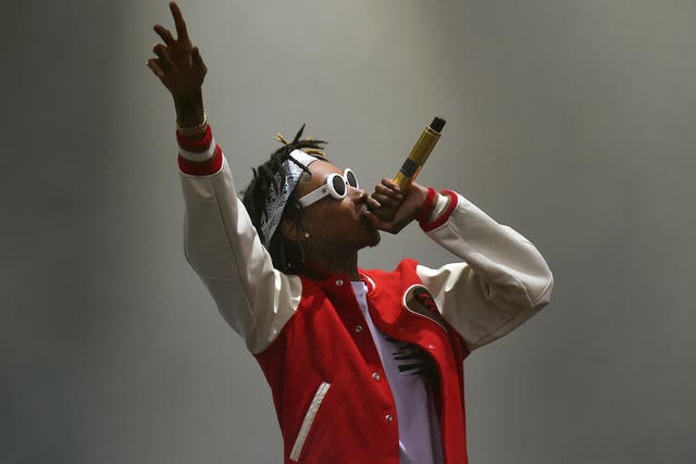 Wiz Khalifa performs on stage during day one of the Wireless Festival at Perry Park in Birmingham