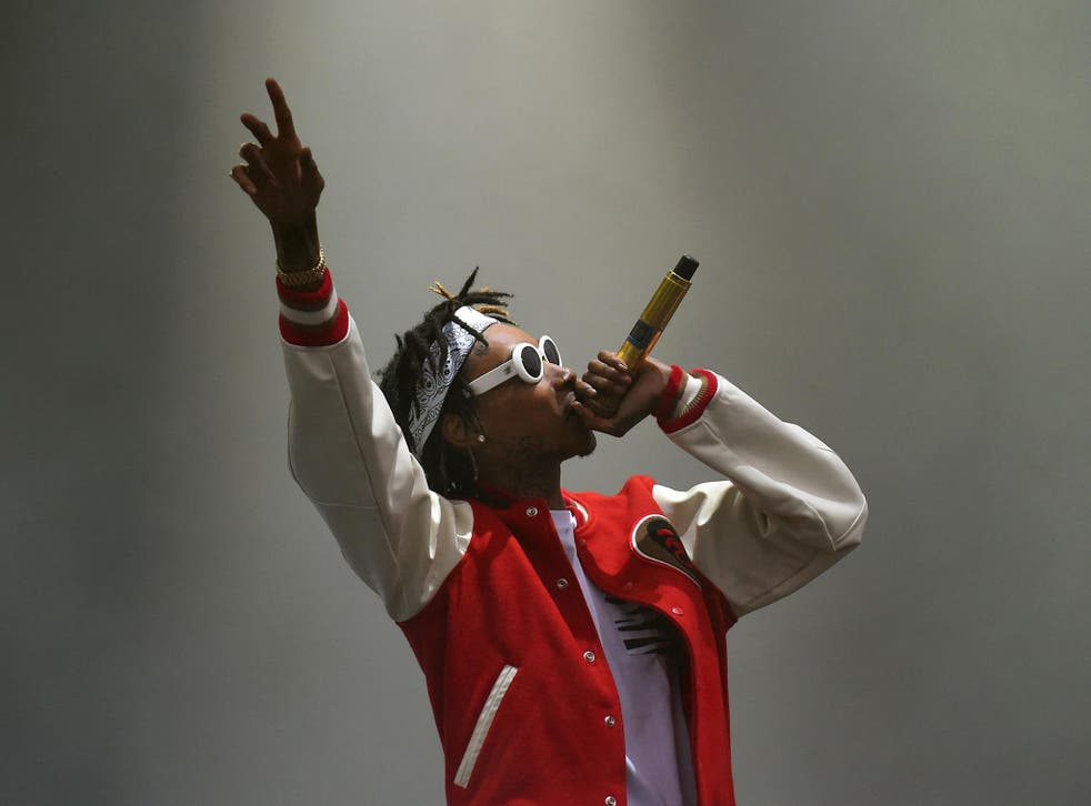 Wiz Khalifa performs on stage during day one of the Wireless Festival at Perry Park in Birmingham