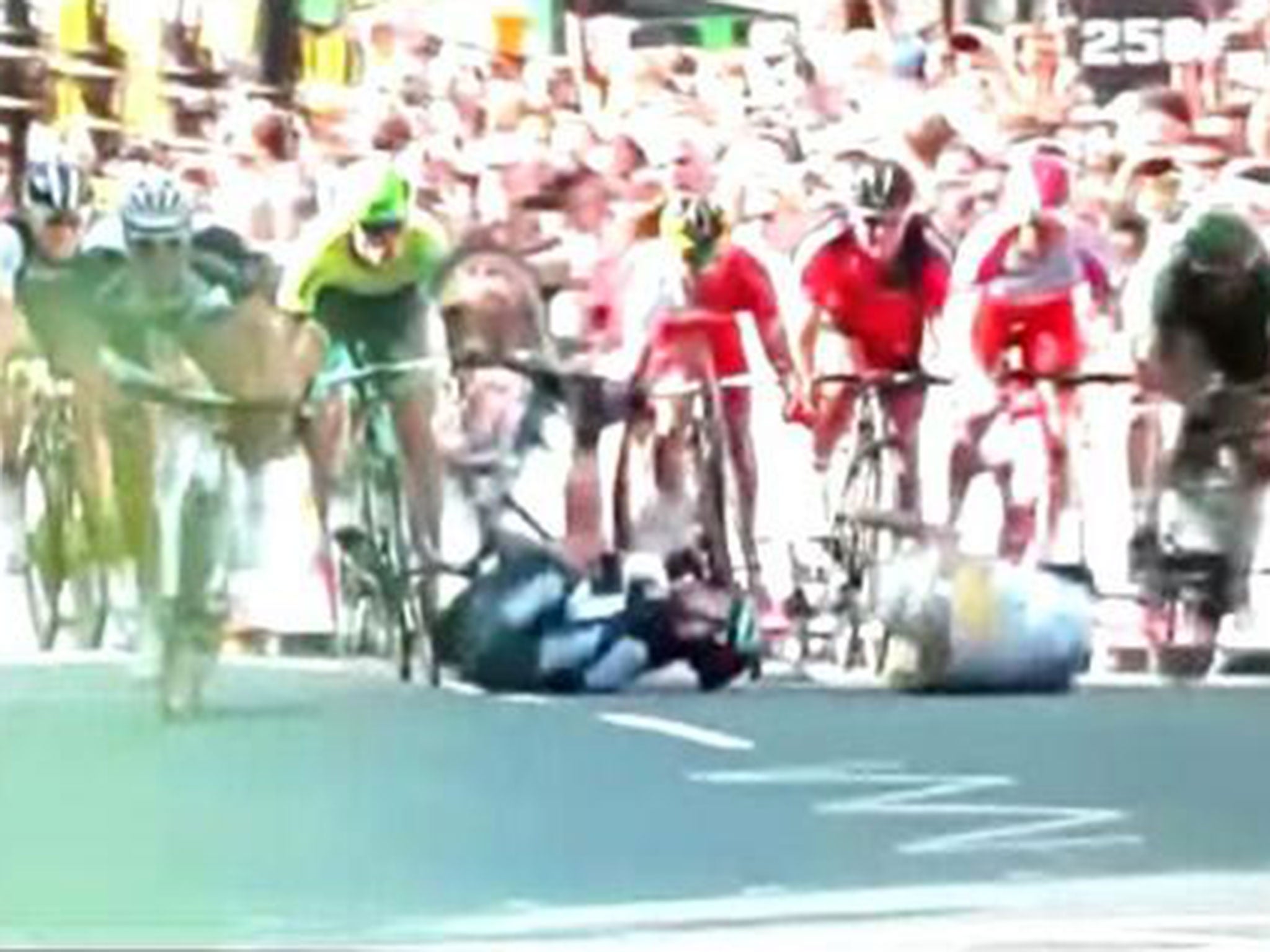 Mark Cavendish hits the ground after he is caught up in a crash with Simon Gerrans