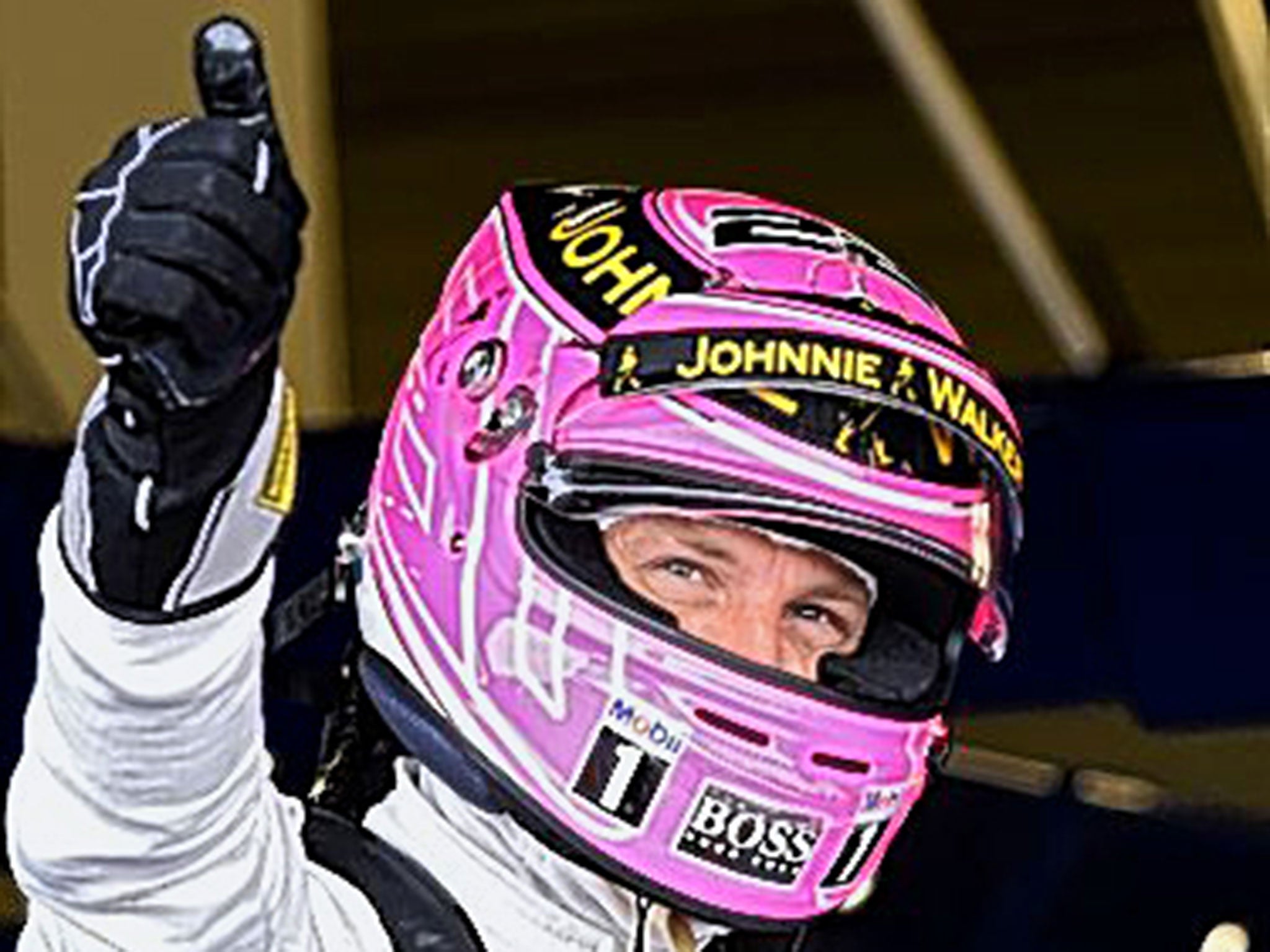 Jenson Button wearing a special pink helmet in memory of his father John
