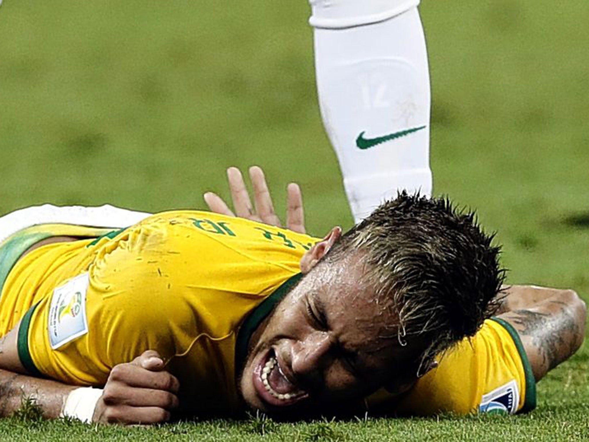 Agony: Neymar feels the pain of the challenge that put him out of the World Cup