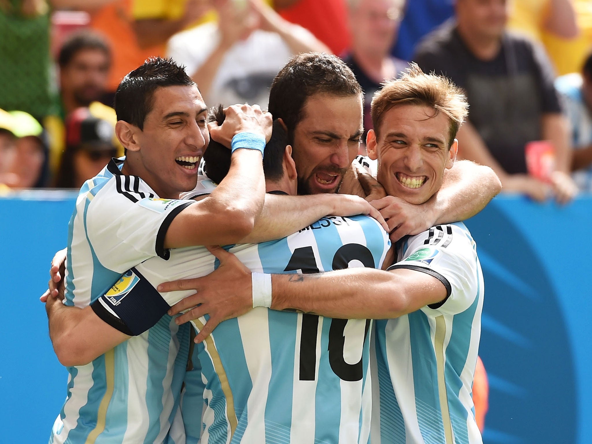 Gonzalo Higuain of Argentina (2nd L) celebrates scoring his team's first goal with Angel di Maria (L), Lionel Messi (2nd L) and Lucas Biglia