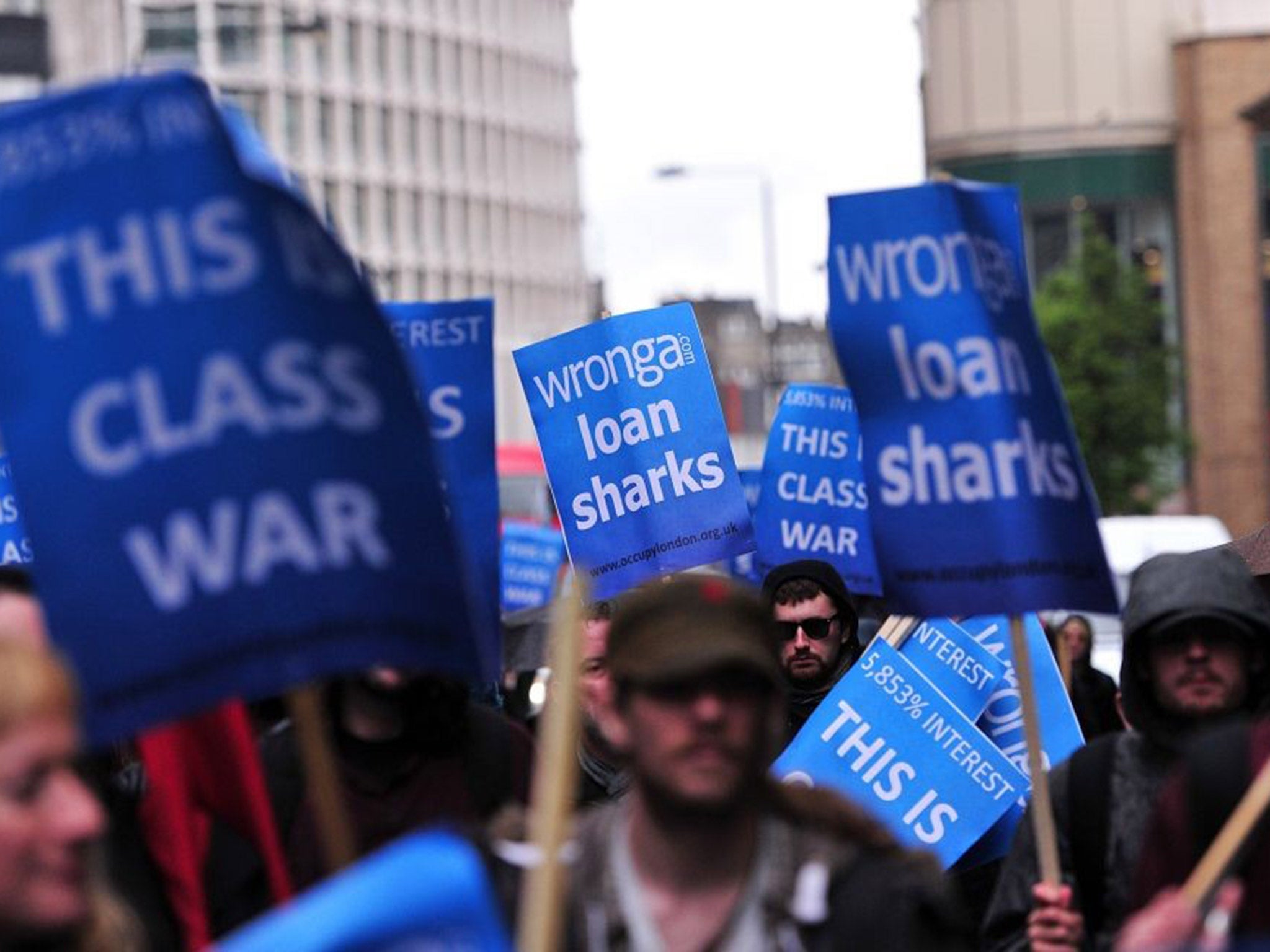 Protesters rally against Britain’s biggest payday lender