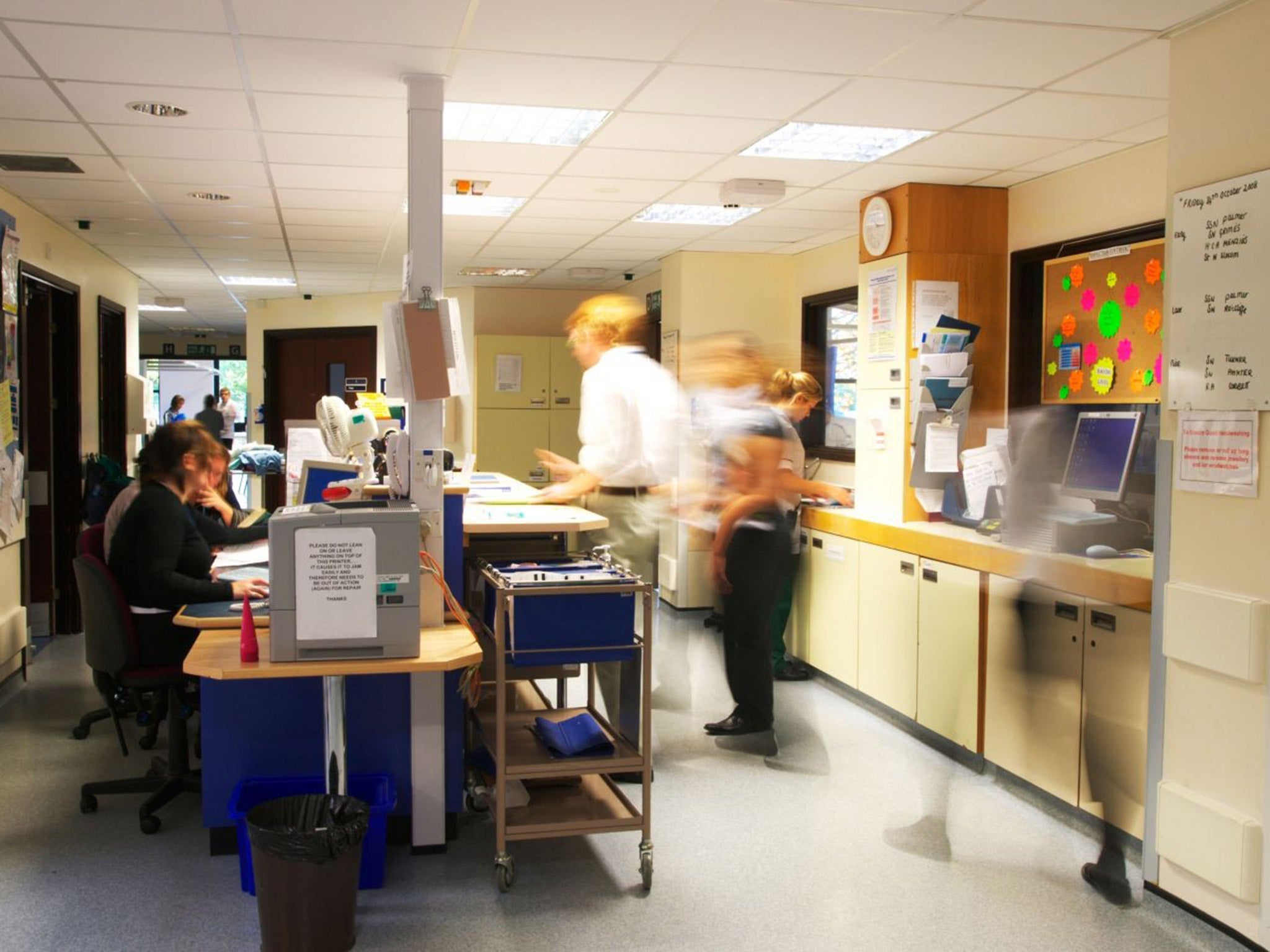 Staff work in a busy NHS surgery