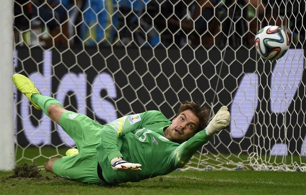 Substitute goalkeeper Tim Krul saves a penalty during the Netherlands' quarter-final shootout victory over Costa Rica