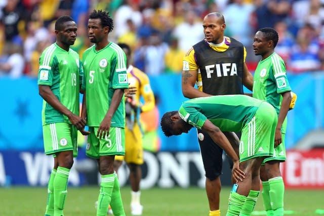 John Obi Mikel of Nigeria reacts with teammates after being defeated by France 2-0 during the 2014 FIFA World Cup Brazil Round of 16 match between France and Nigeria