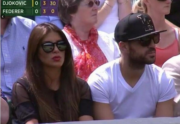 Cesc Fabregas watches the Wimbledon final with his girlfriend Daniella Semaan