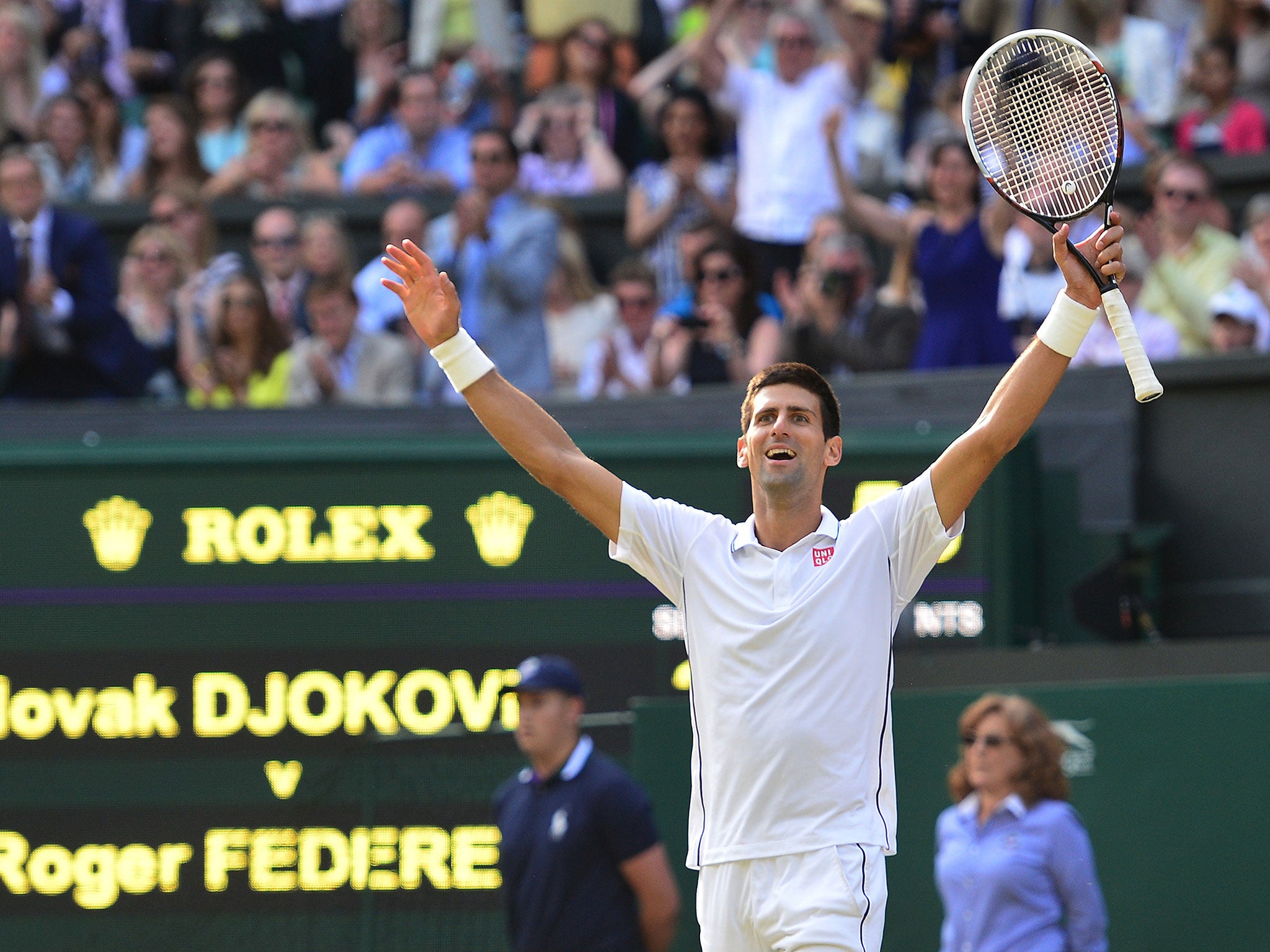 Novak Djokovic celebrates his victory over Roger Federer