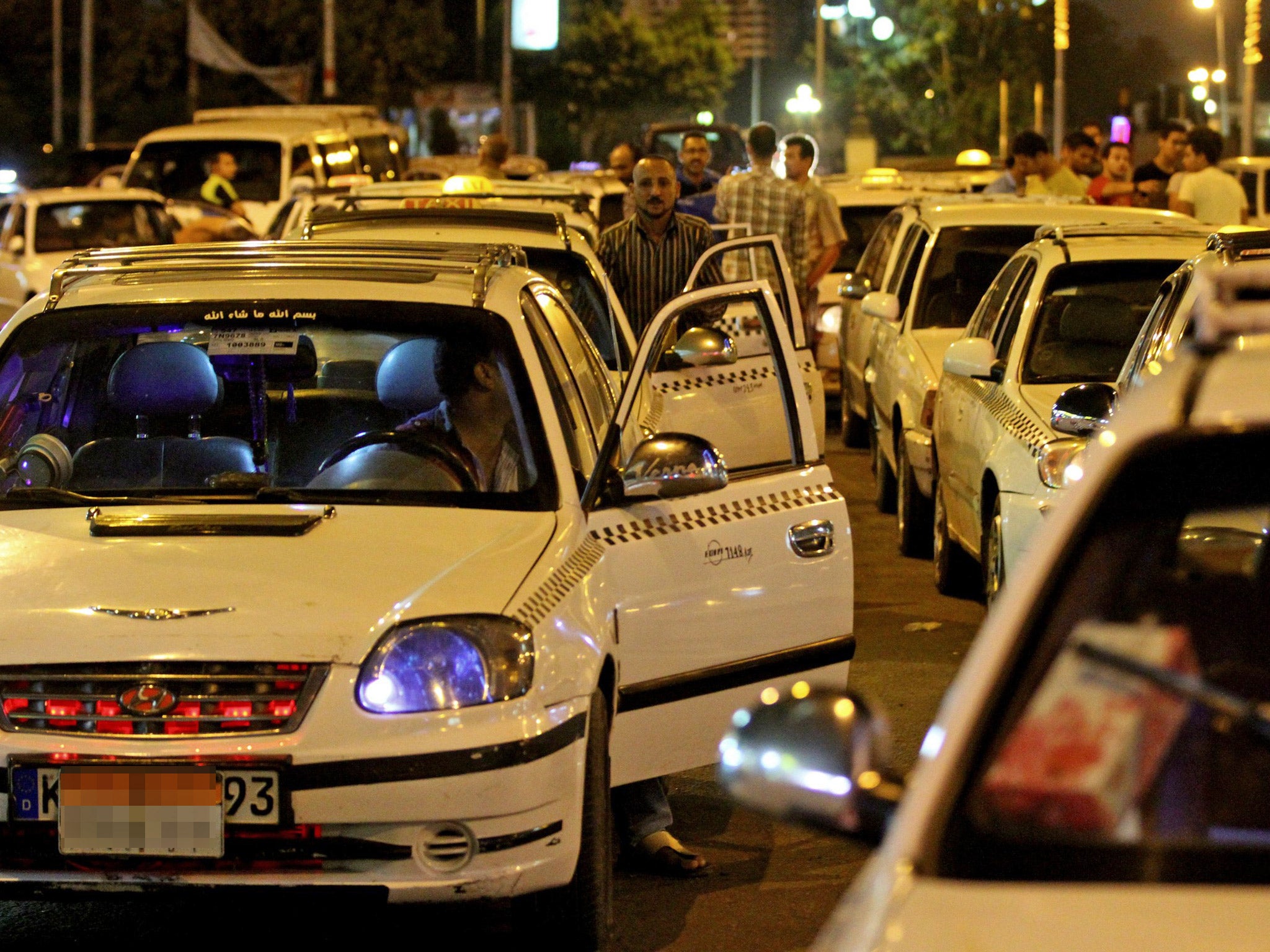Angry taxi drivers queue up at petrol stations in Cairo