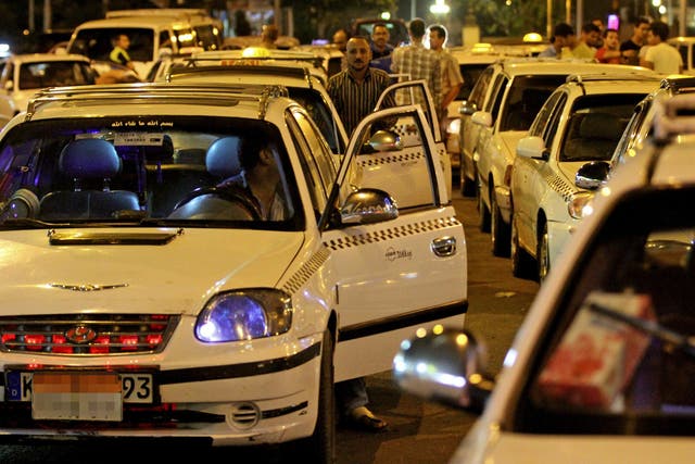 Angry taxi drivers queue up at petrol stations in Cairo