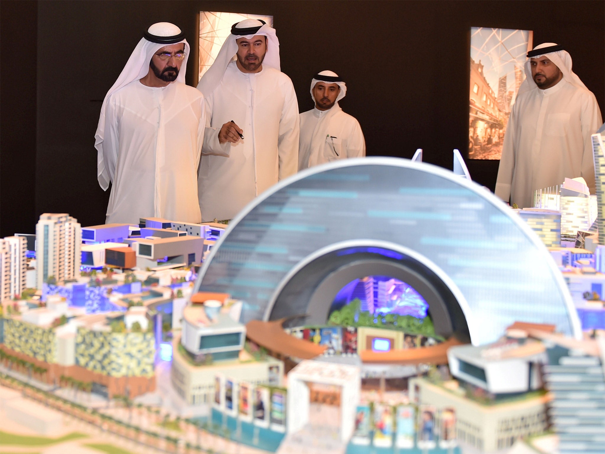 Sheikh Mohammed Bin Rashid al-Maktoum (left), ruler of Dubai, looking at a model of the 'Mall of the World' project during its presentation in Dubai