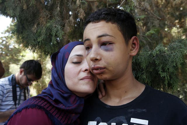 Tariq Khdeir is greeted by his mother after being released from jail in Jerusalem. An Israeli judge released from jail and placed under house arrest the 15-year-old American of Palestinian descent whose apparent beating by Israeli police in East Jerusalem