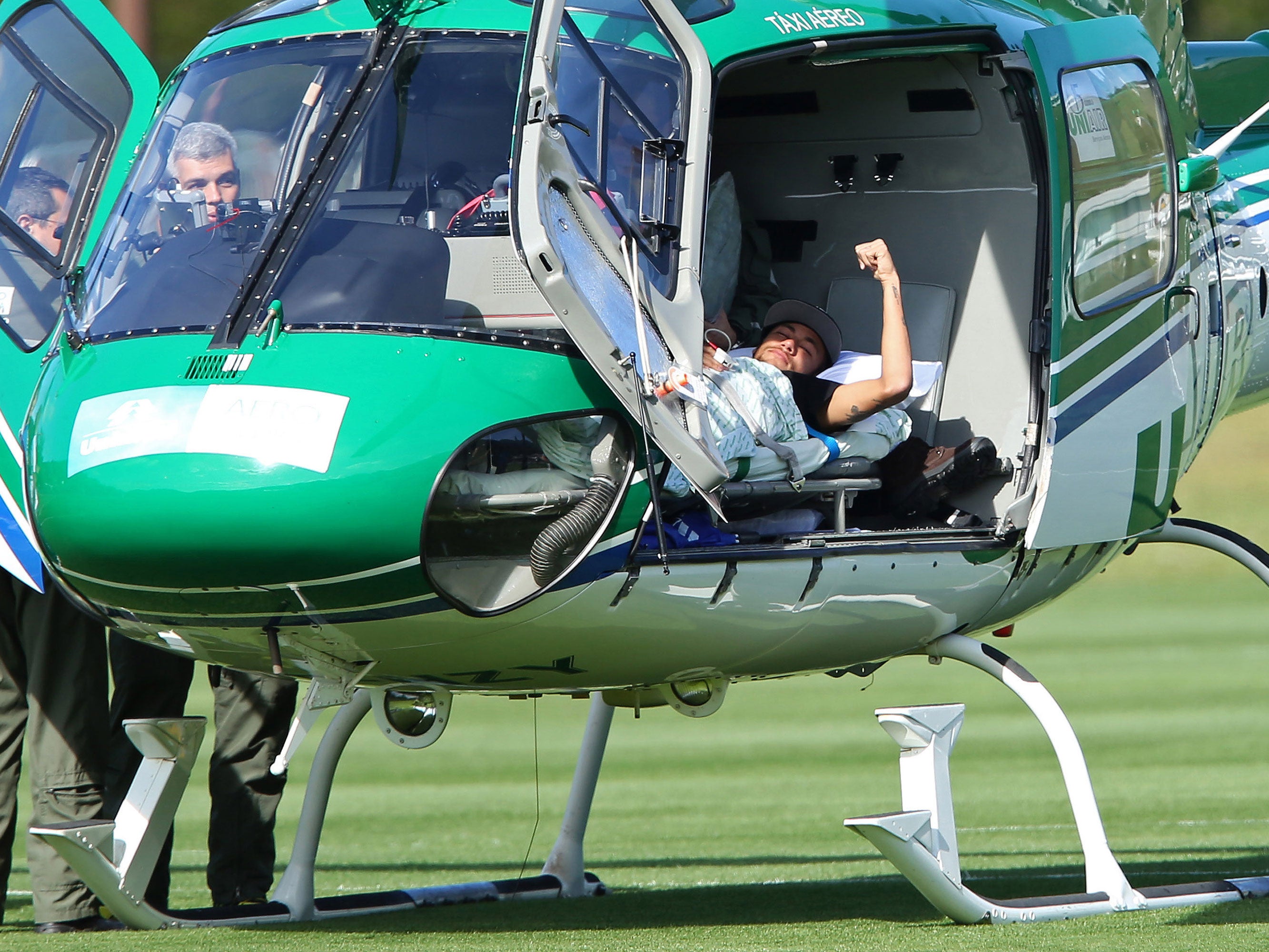 Brazil's Neymar is seen inside a medical helicopter at the Granja Comary training center in Teresopolis, Brazil. Neymar will be treated at home for his back injury