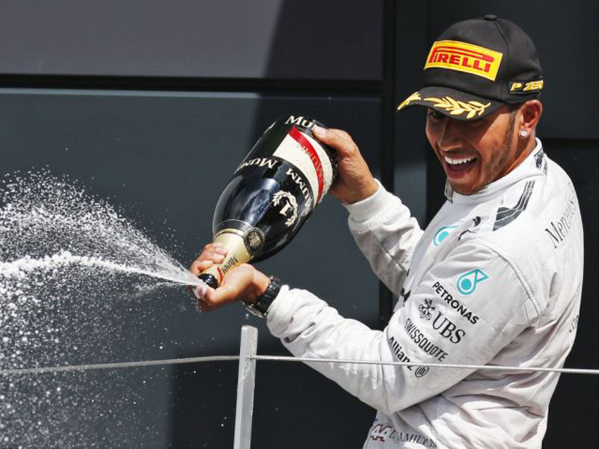 Lewis Hamilton sprays the champagne after his victory at Silverstone