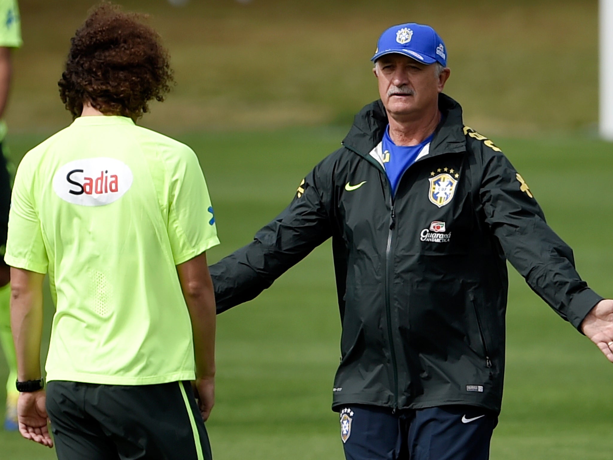 David Luiz is spoken to by Luiz Felipe Scolari ahead of Brazil's semi-final