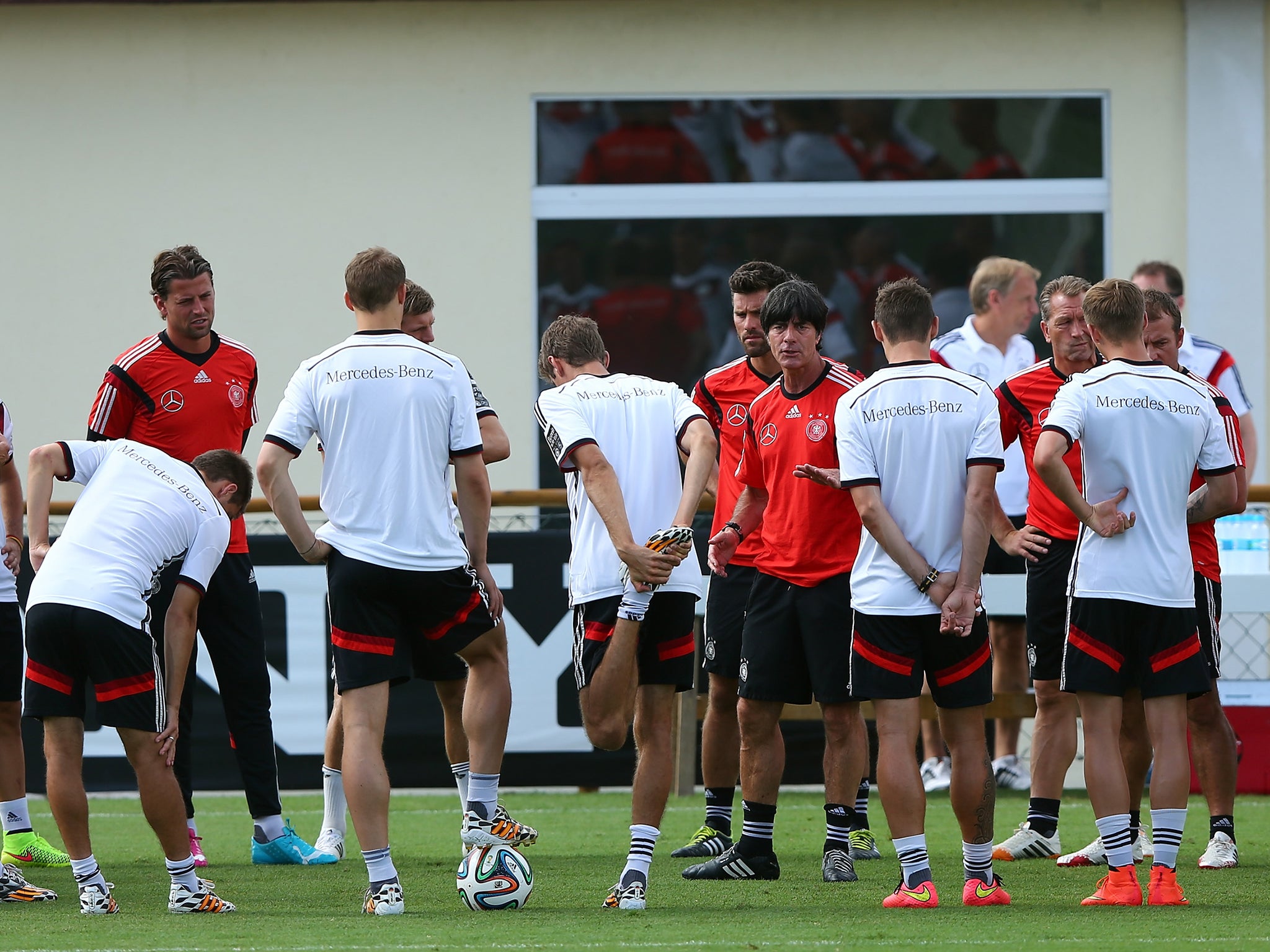 Joachim Low talks to his Germany squad before their semi-final with Brazil