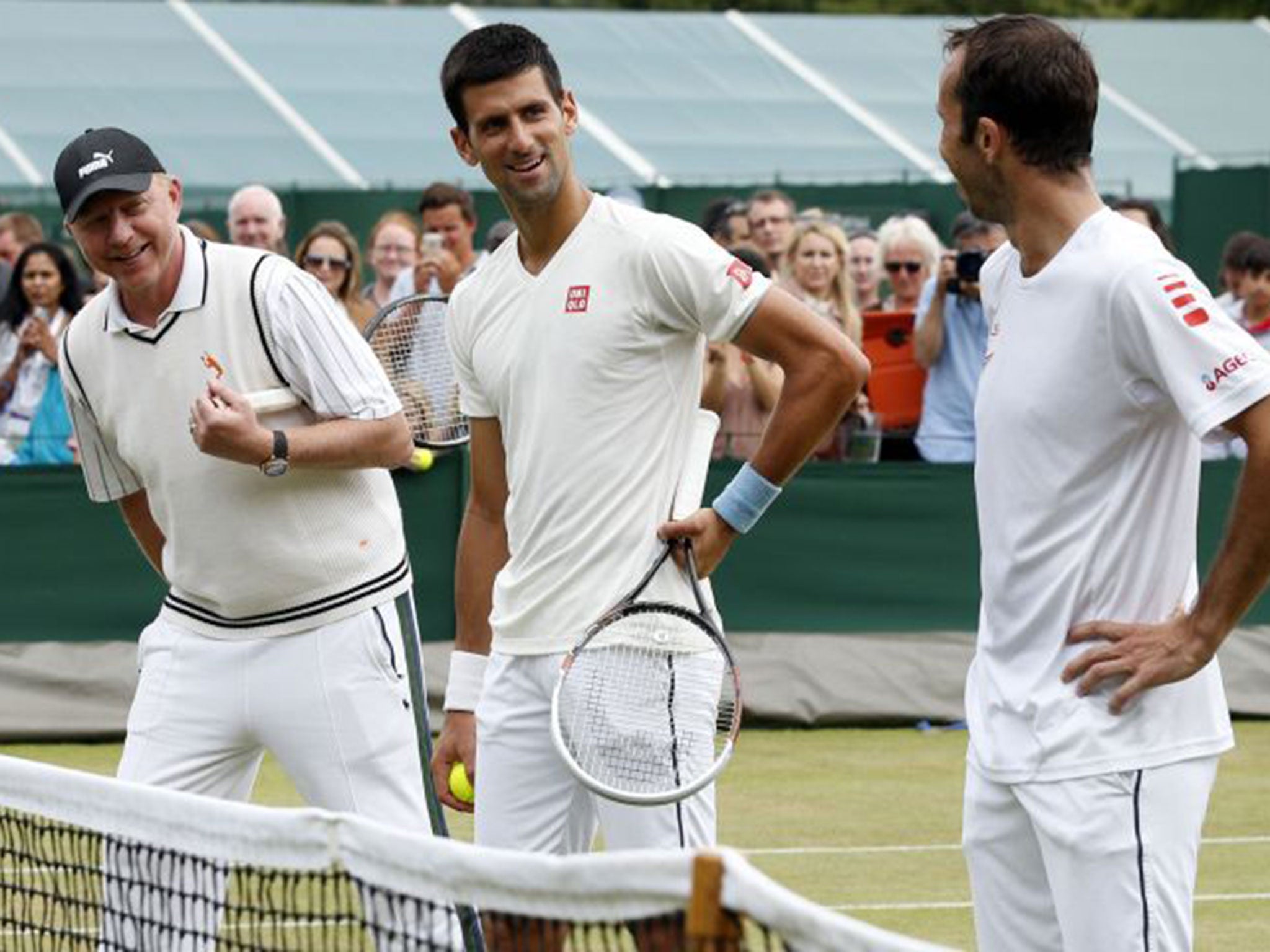 Novak Djokovic practises with coach Boris Becker at the All England Club