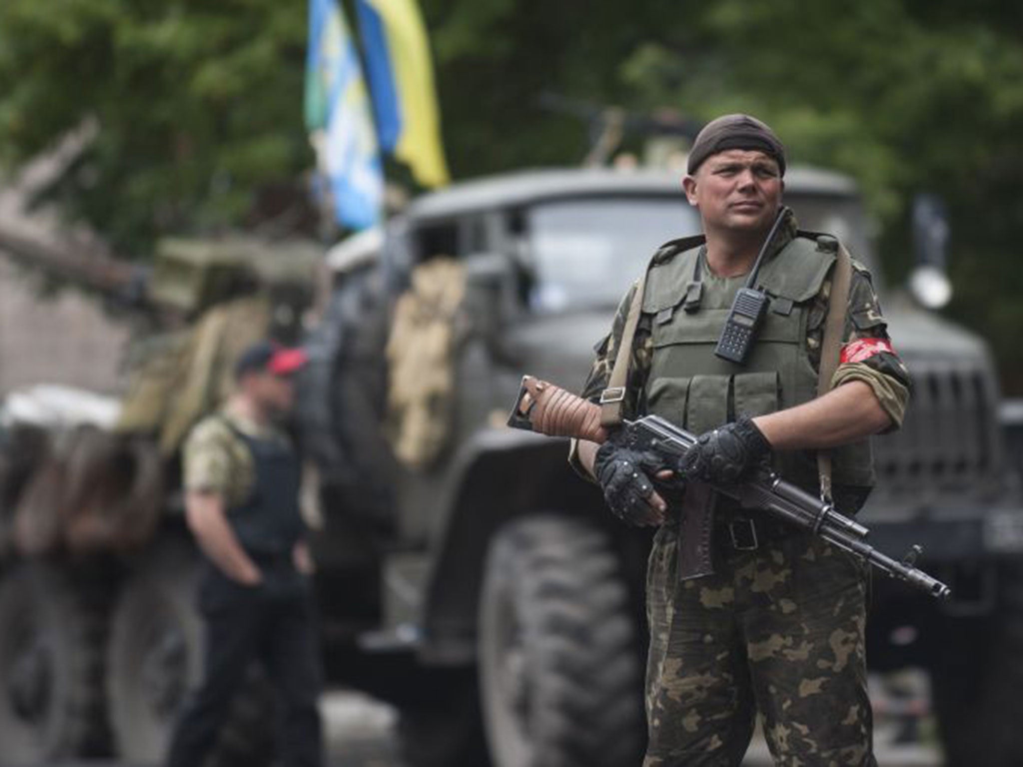 A Ukrainian soldier guards a security building in Slovyansk. On Saturday Ukrainian troops forced the rebels out of the city which had until then been the centre of the fighting