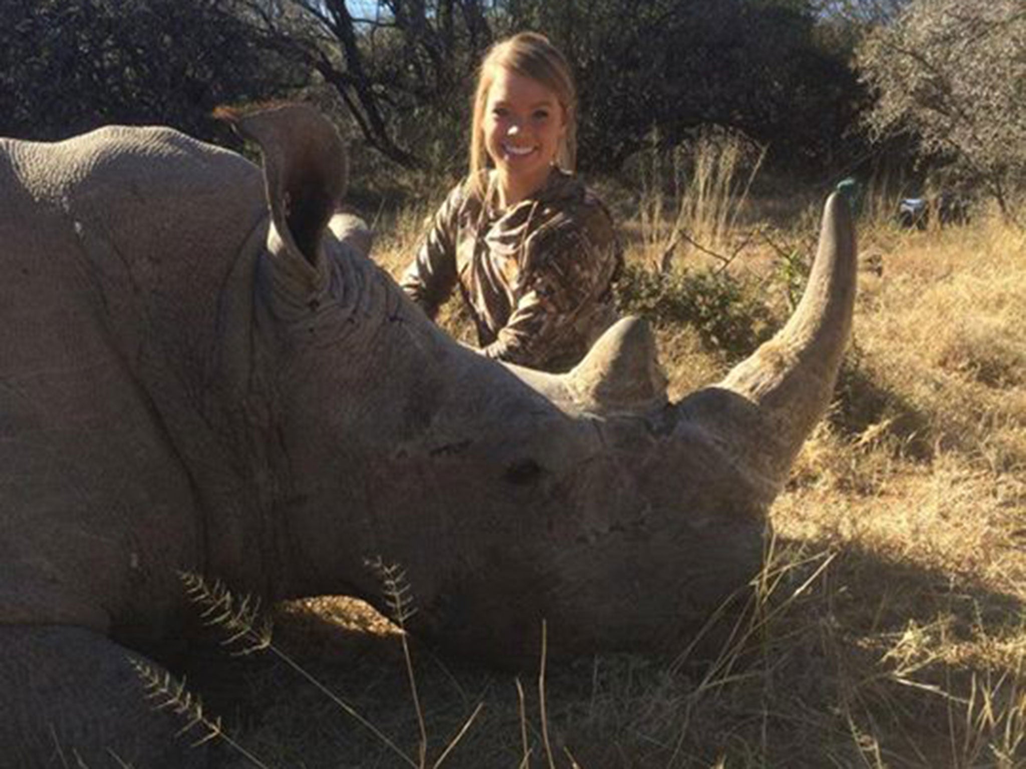 The picture Facebook didn't remove: Kendall Jones poses with a rhinoceros she claims is "not dead and not asleep, it's immobilised".