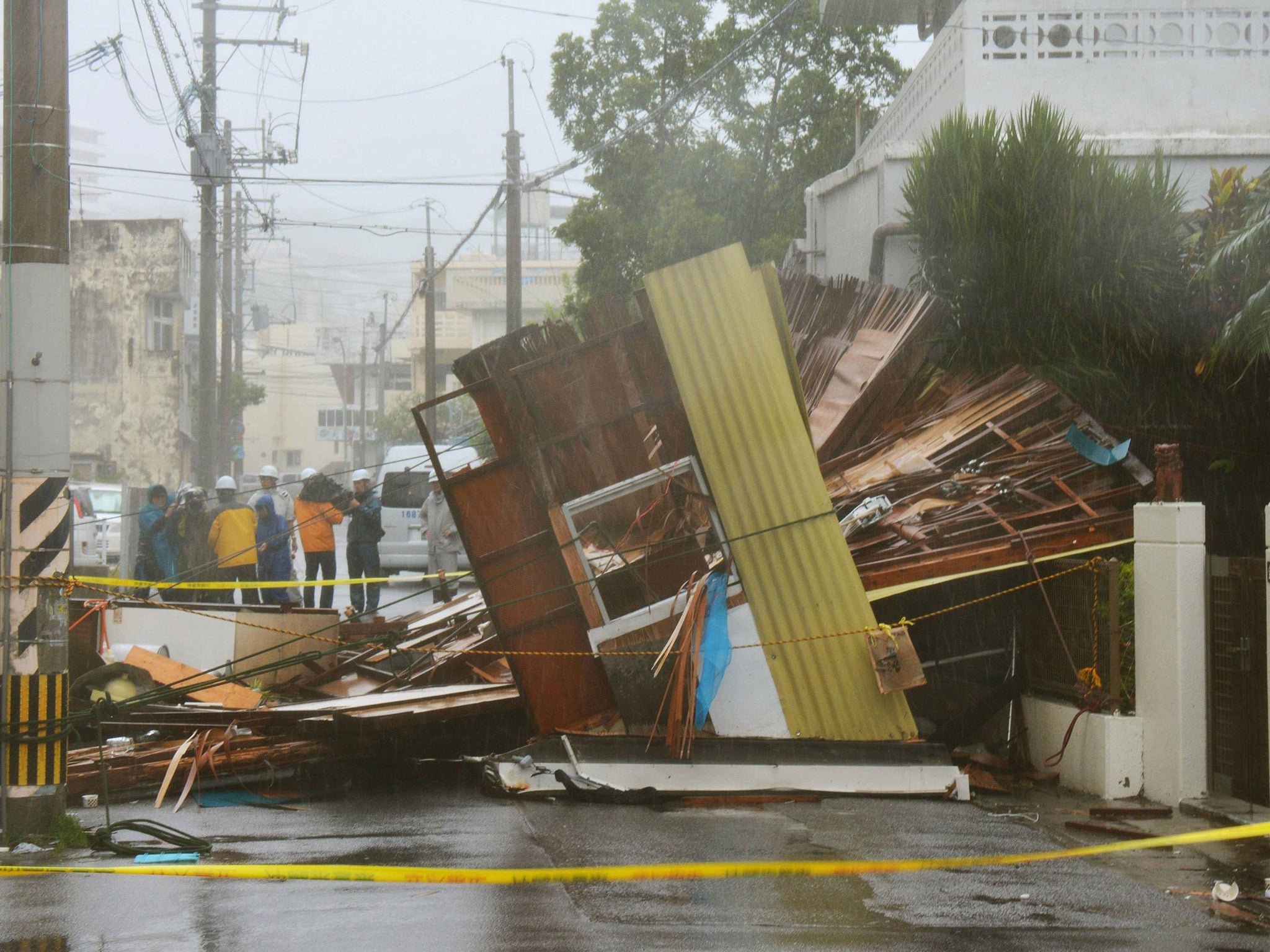 A wooden house collapsed due to strong winds caused by Typhoon Neoguri in Naha, on Japan's southern island of Okinawa