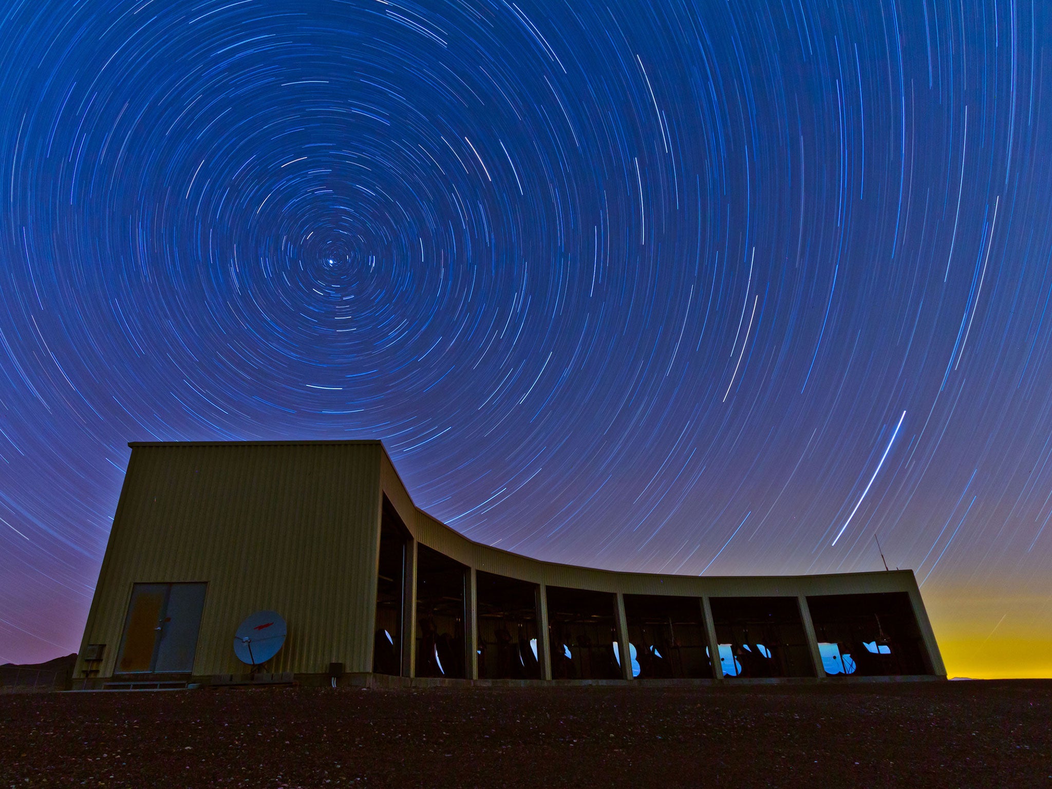 A time-lapse photo of the Middle Drum facility of the Telescope Array, a $25 million cosmic ray observatory that sprawls across the desert west of Delta, Utah. 