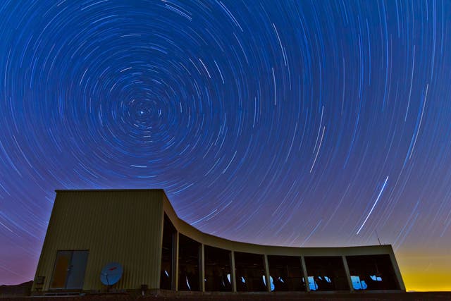 A time-lapse photo of the Middle Drum facility of the Telescope Array, a $25 million cosmic ray observatory that sprawls across the desert west of Delta, Utah.