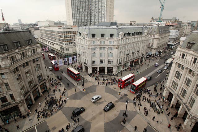 Vehicles negotiate Oxford Circus junction at the intersection of Oxford Street and Regent Street 
