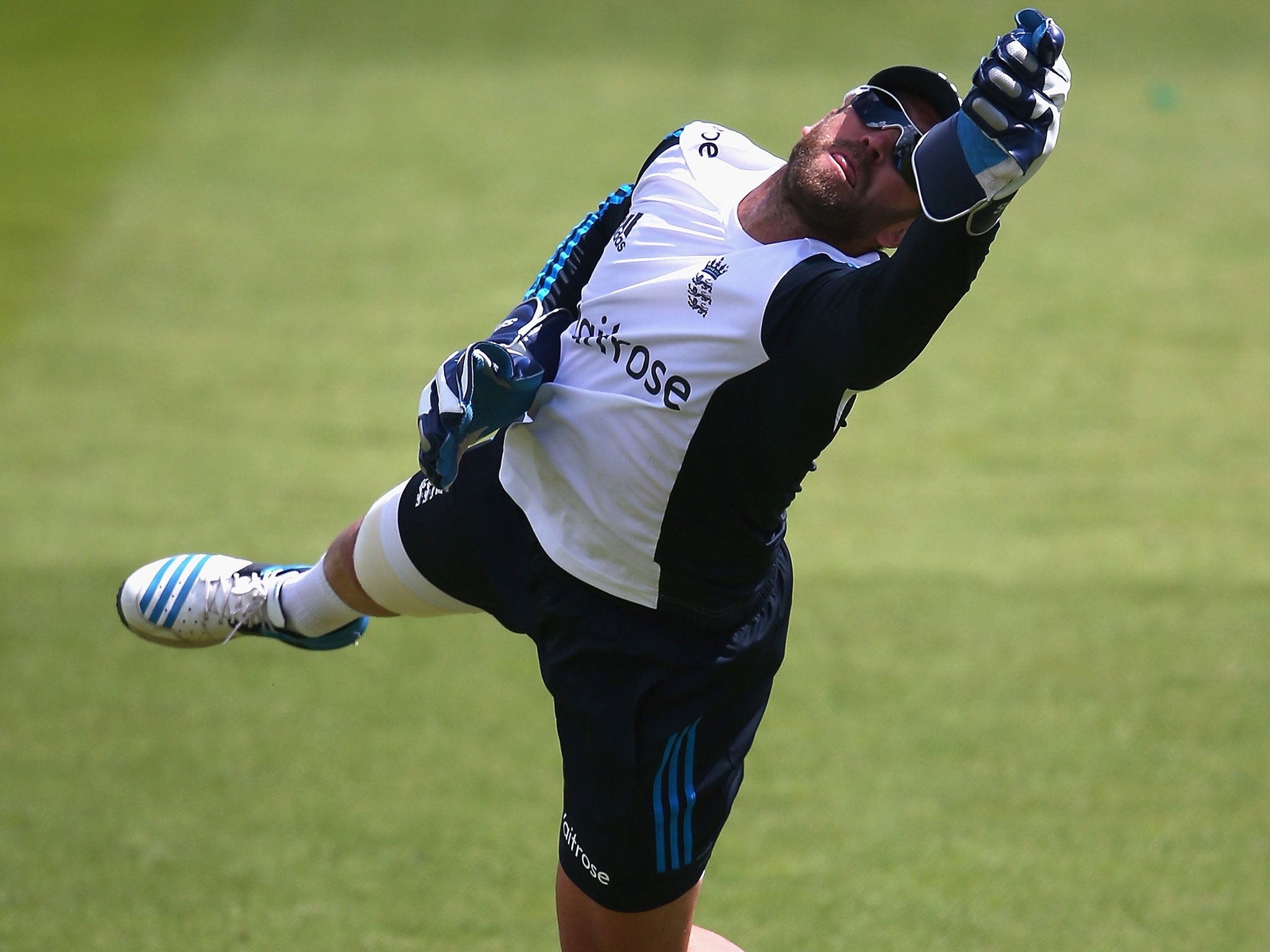 Matt Prior dives during training ahead of England's first Test against India