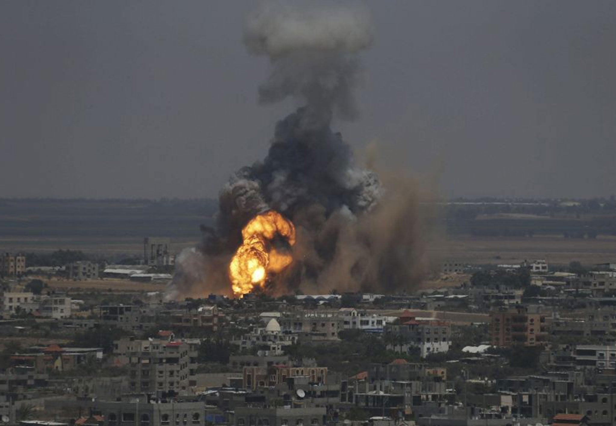 Smoke and flames are seen following what police said was an Israeli air strike in Rafah in the southern Gaza Strip
