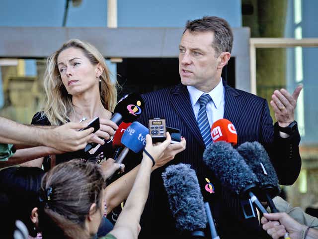 Kate McCann and her husband Gerry talk to reporters after they delivered statements to the court in Lisbon