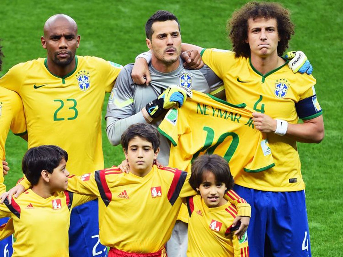 Brazil vs Germany World Cup 2014: Brazil pay tribute to the injured Neymar  by holding his shirt during the national anthem, The Independent