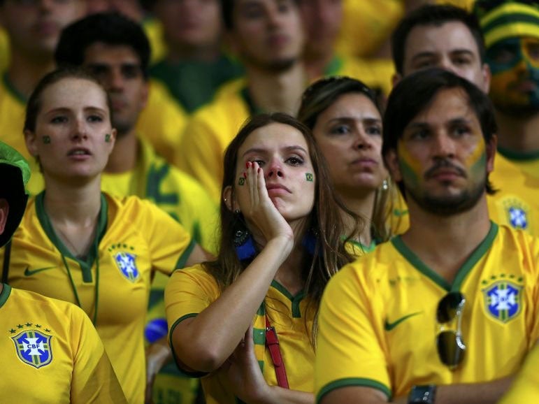 Brazil fans react during the 2014 World Cup semi-finals between Brazil and Germany at the Mineirao stadium in Belo Horizonte July 8, 2014.